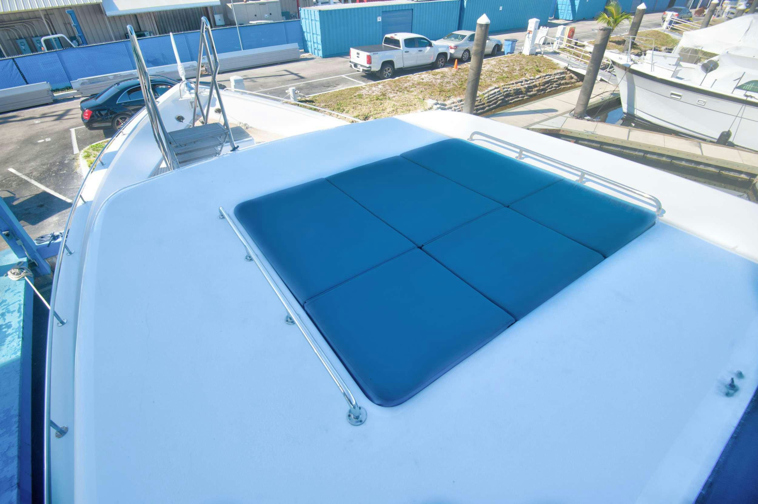 a white car with a blue roof aboard DESLIZE Yacht for Charter