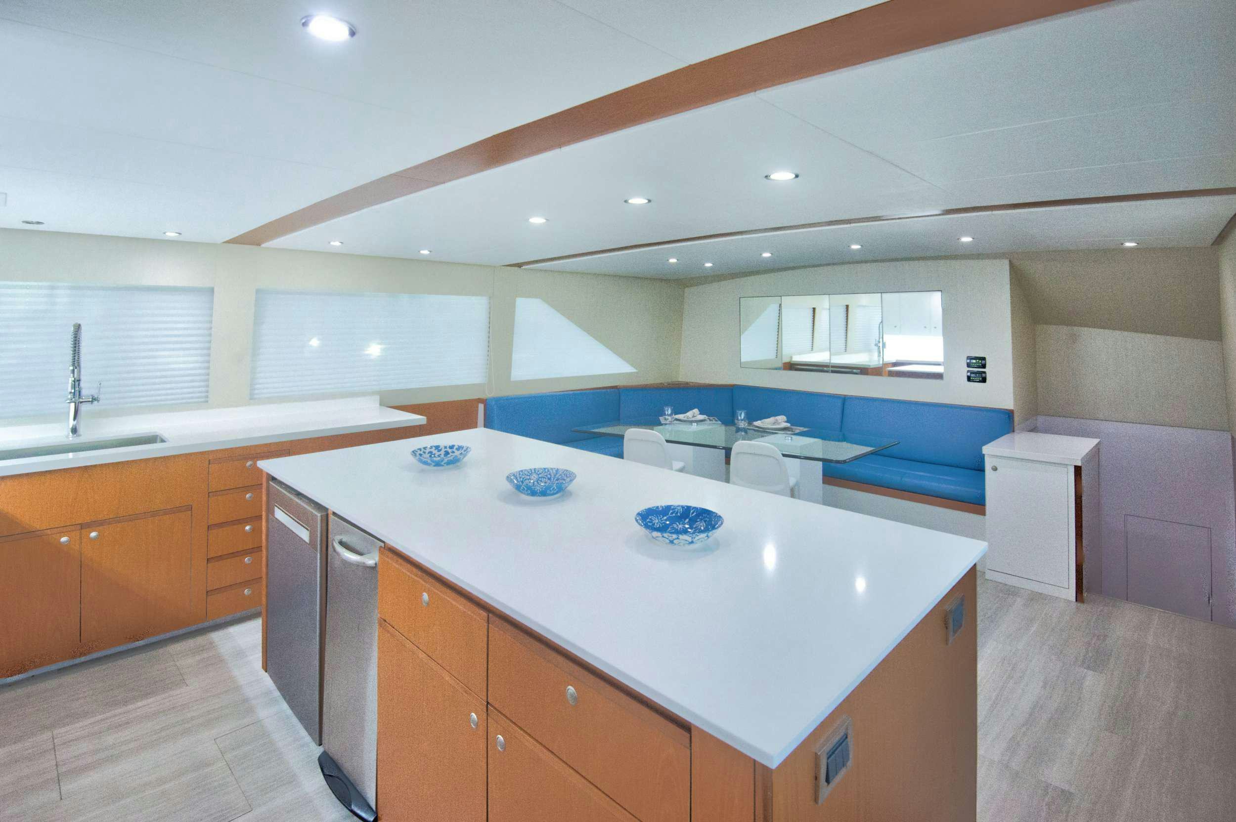 a kitchen with a large island aboard DESLIZE Yacht for Charter