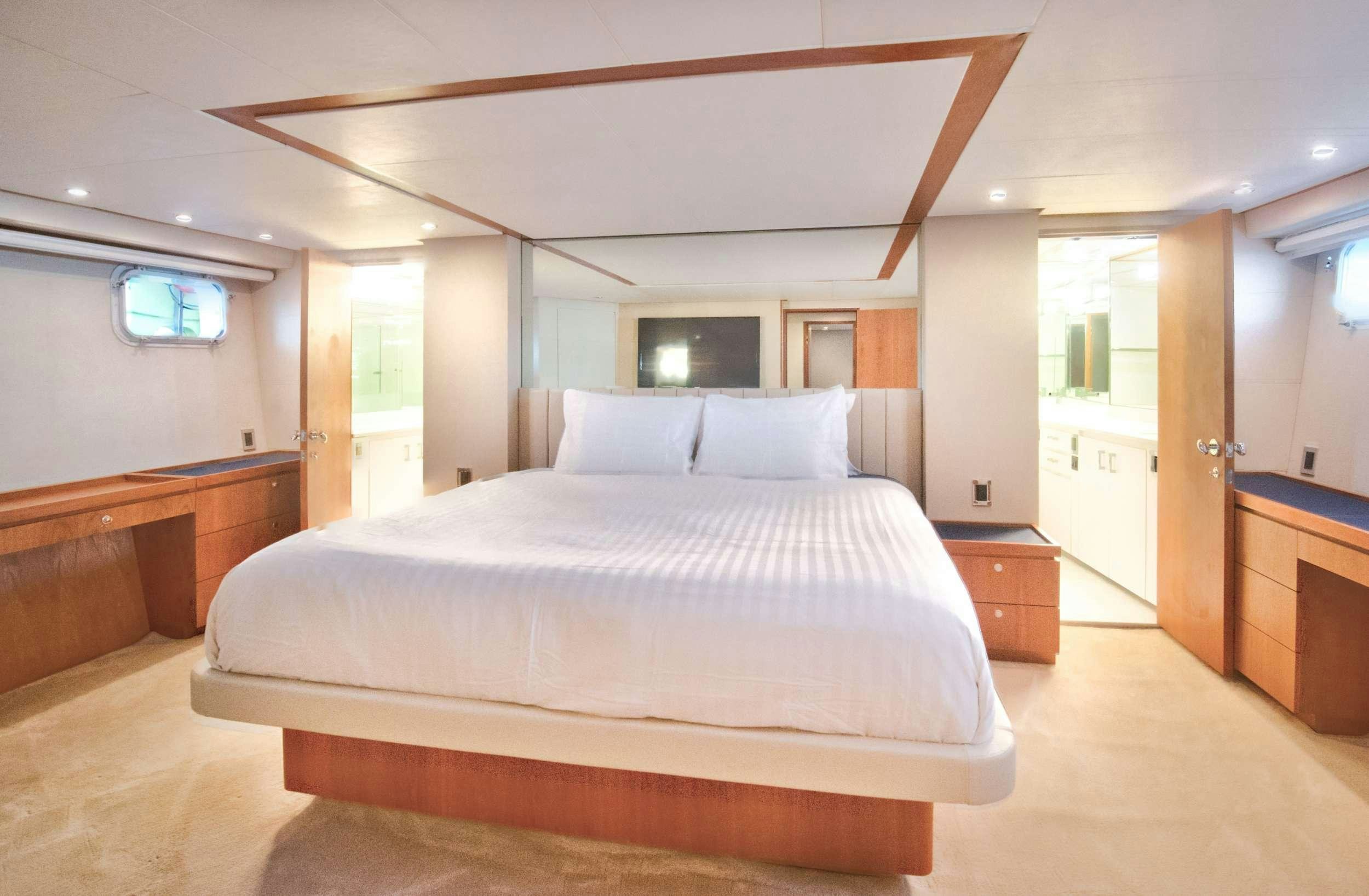 a bed in a room aboard DESLIZE Yacht for Charter