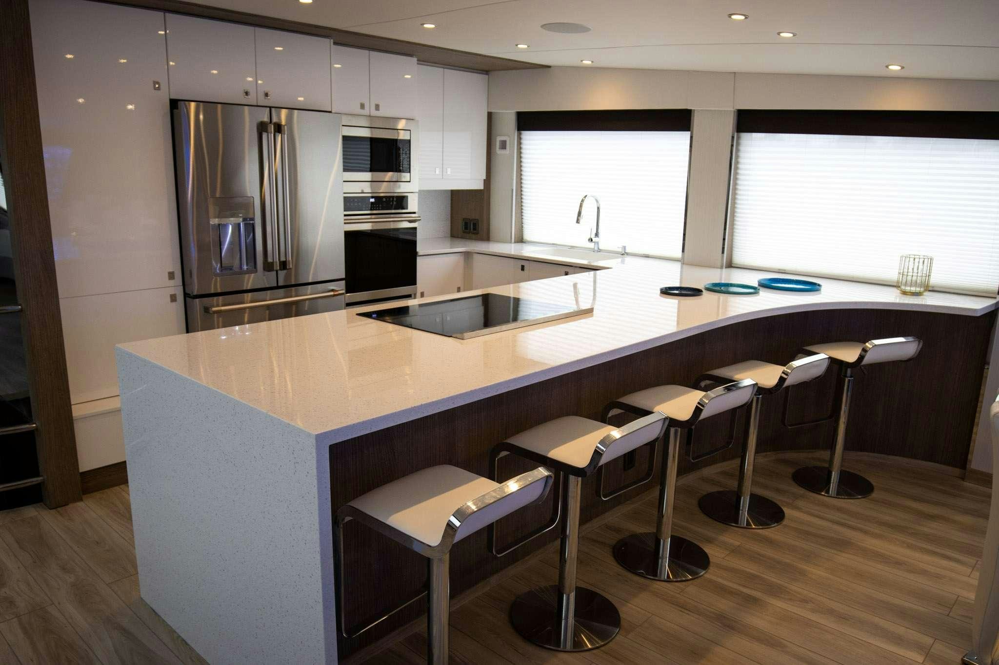 a kitchen with a large island aboard JULIANNE Yacht for Charter