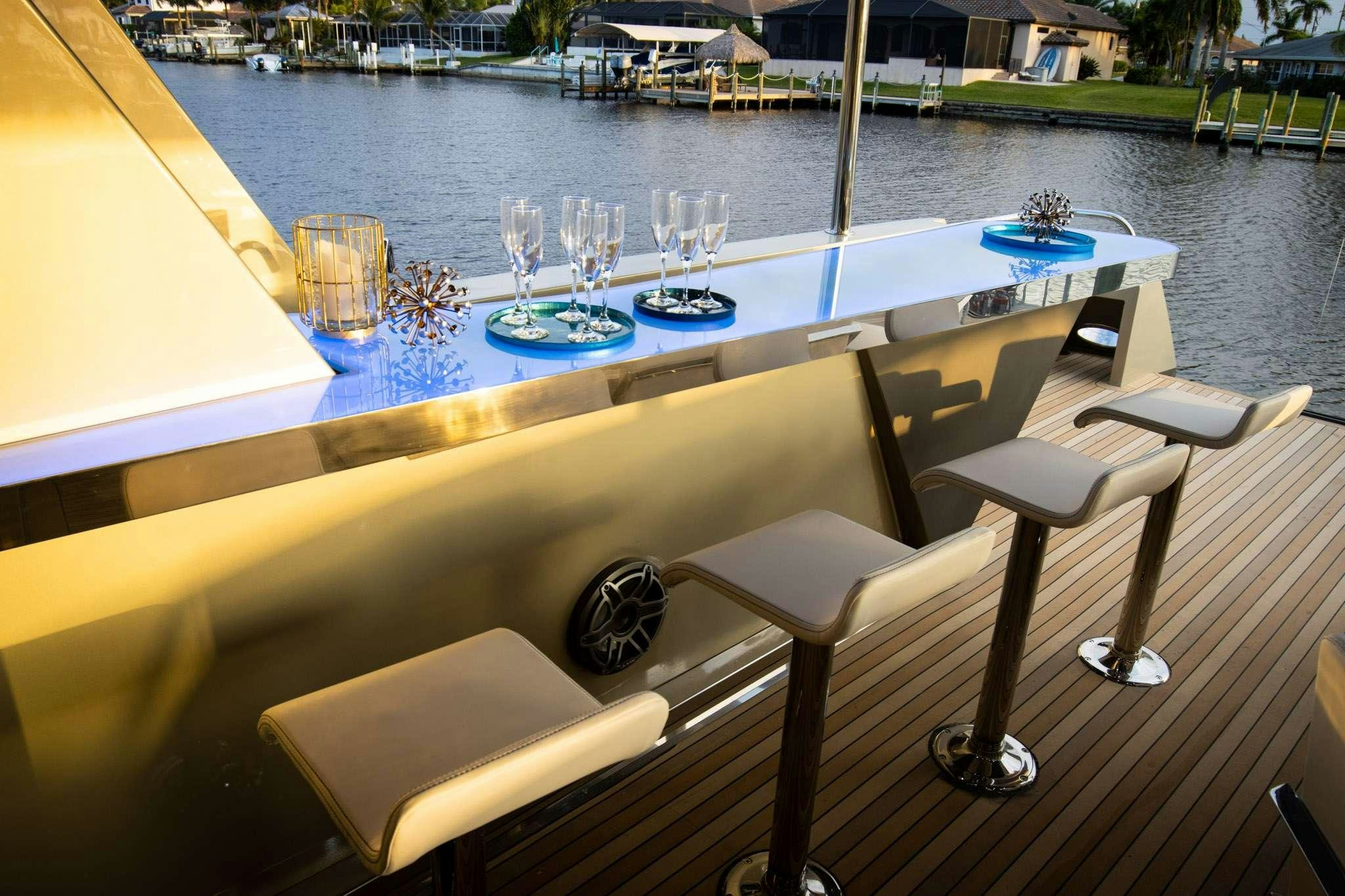 a table with wine glasses on it aboard JULIANNE Yacht for Charter