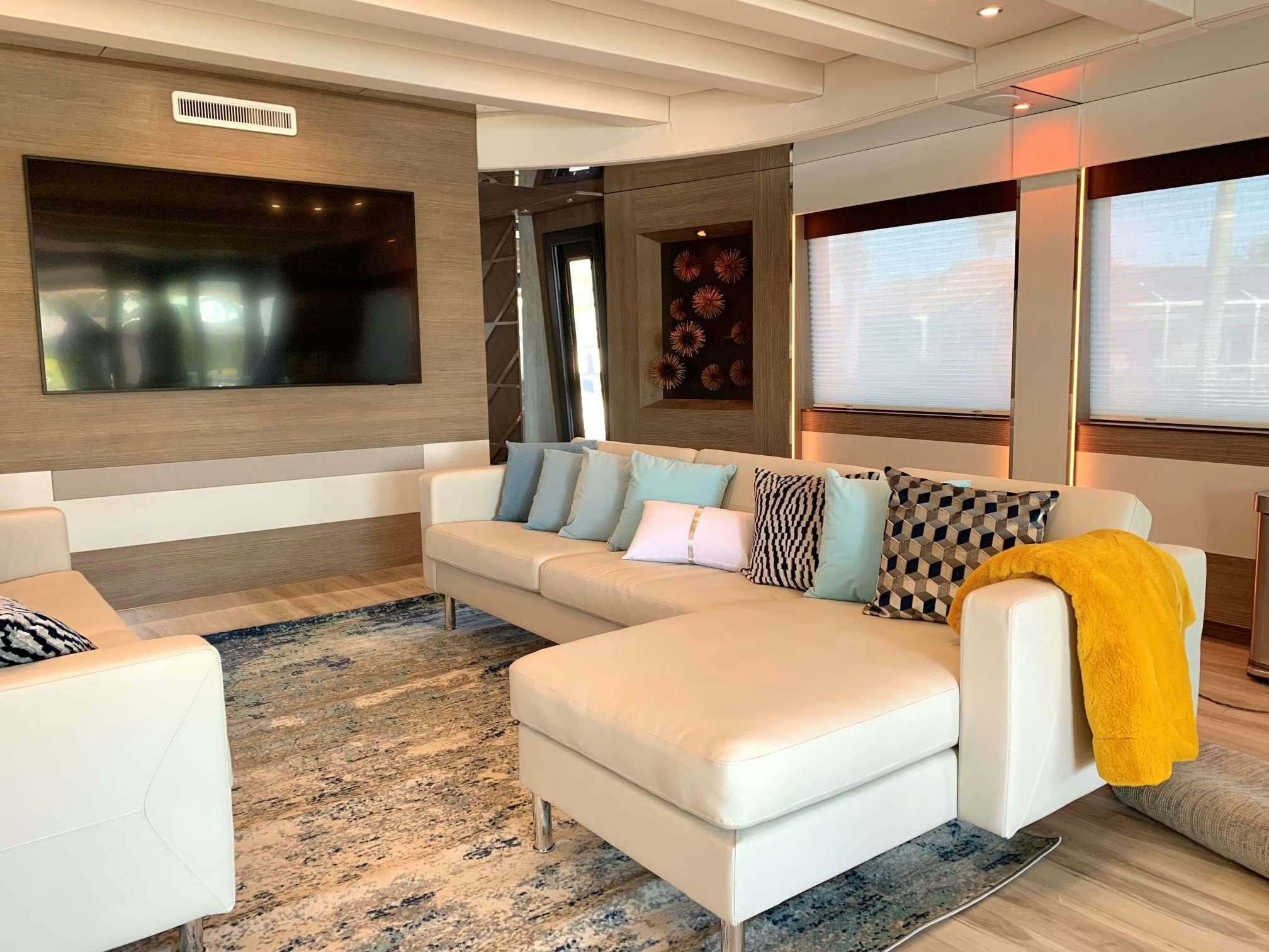 a living room with a couch and a fireplace aboard JULIANNE Yacht for Charter