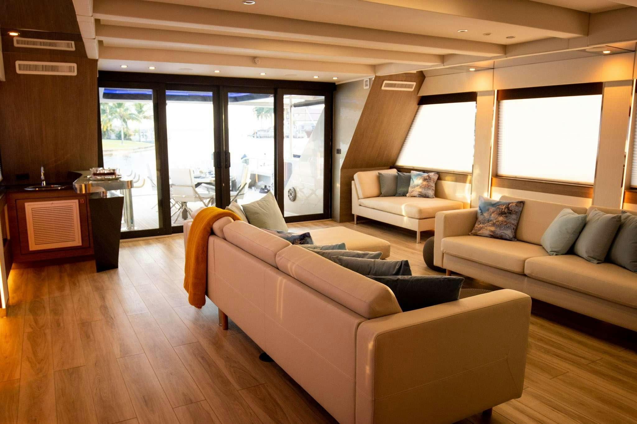 a living room with a couch and a table aboard JULIANNE Yacht for Charter