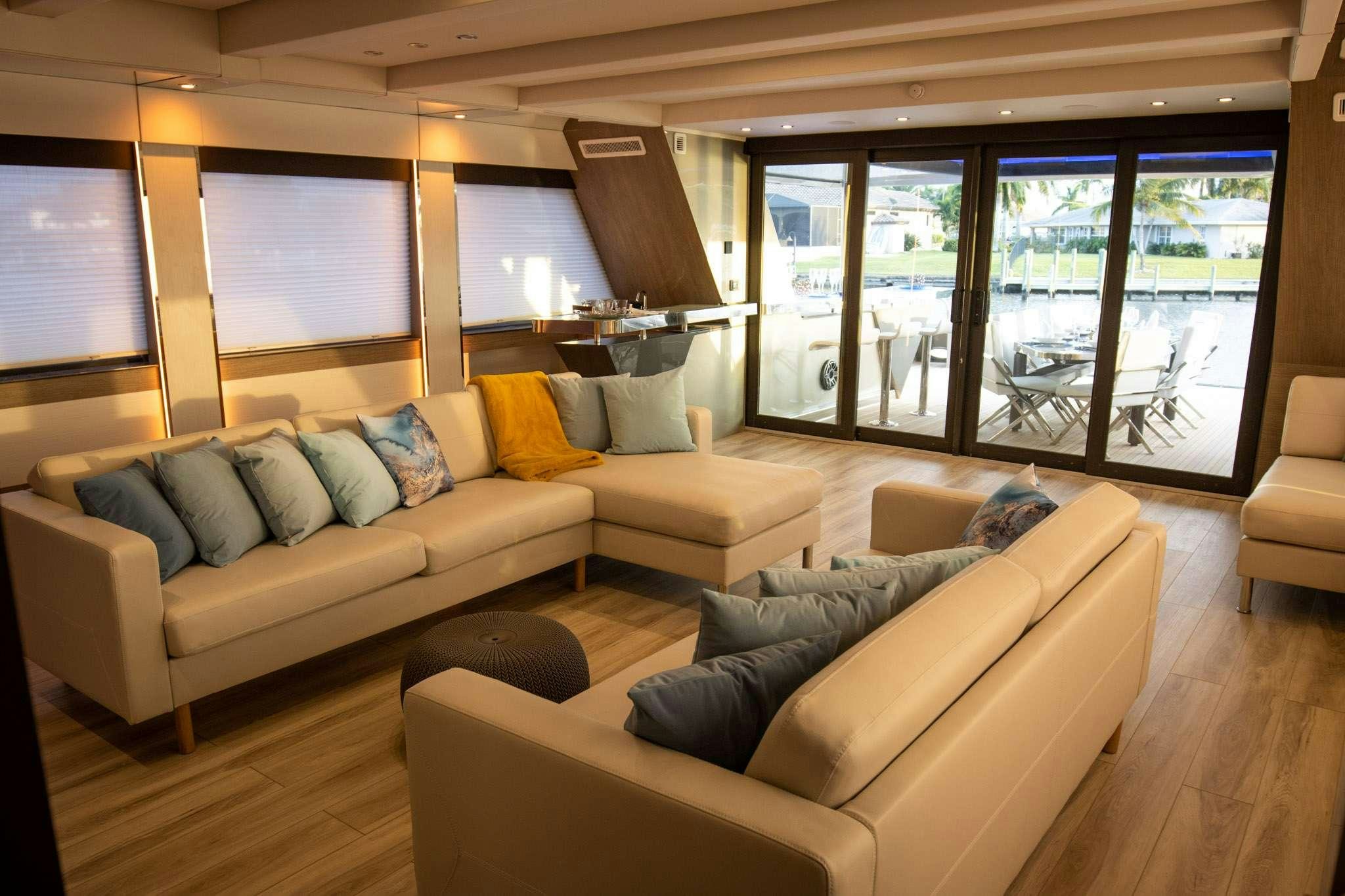 a living room with a couch and a table aboard JULIANNE Yacht for Charter