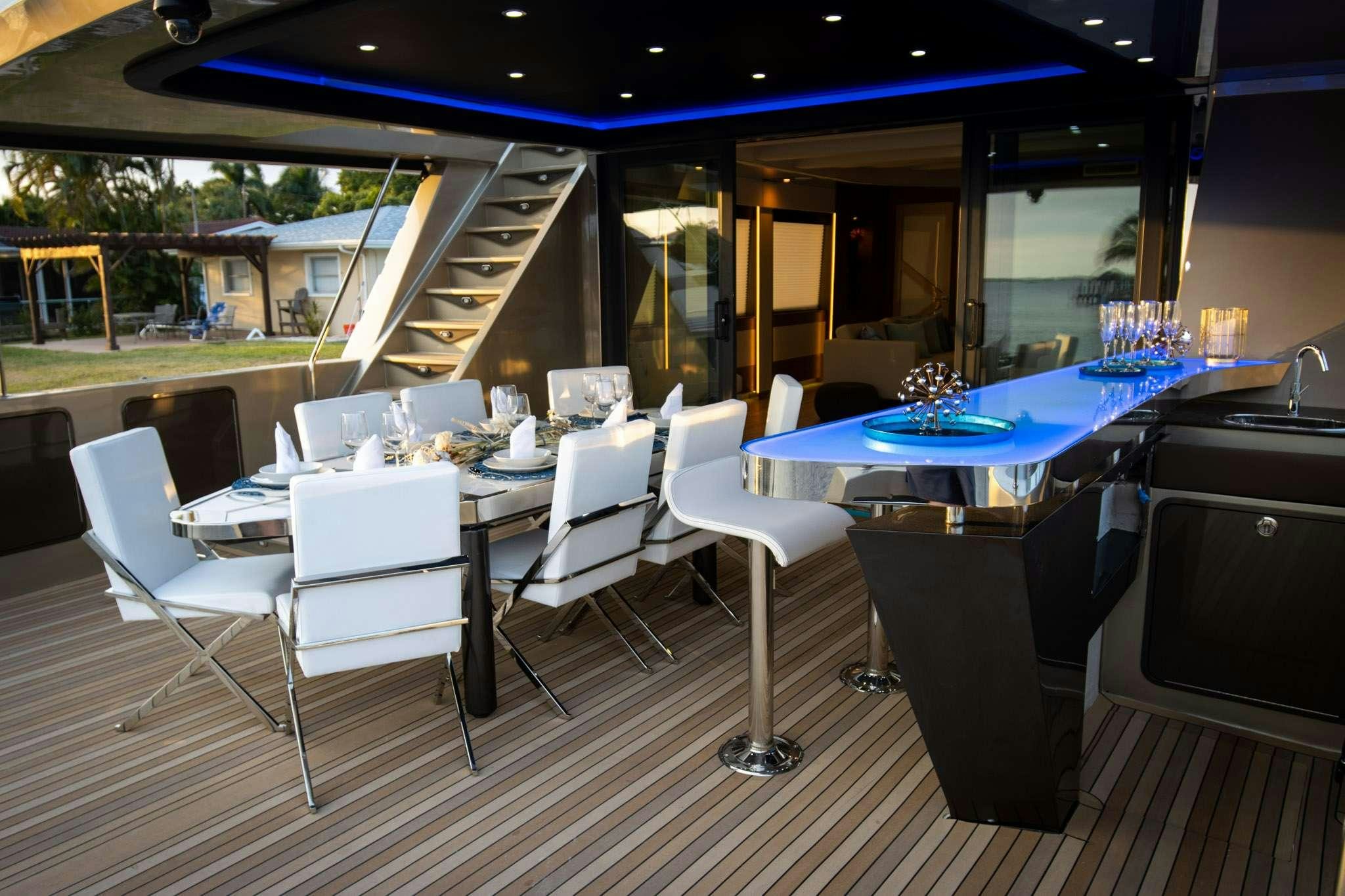 a room with tables and chairs aboard JULIANNE Yacht for Charter