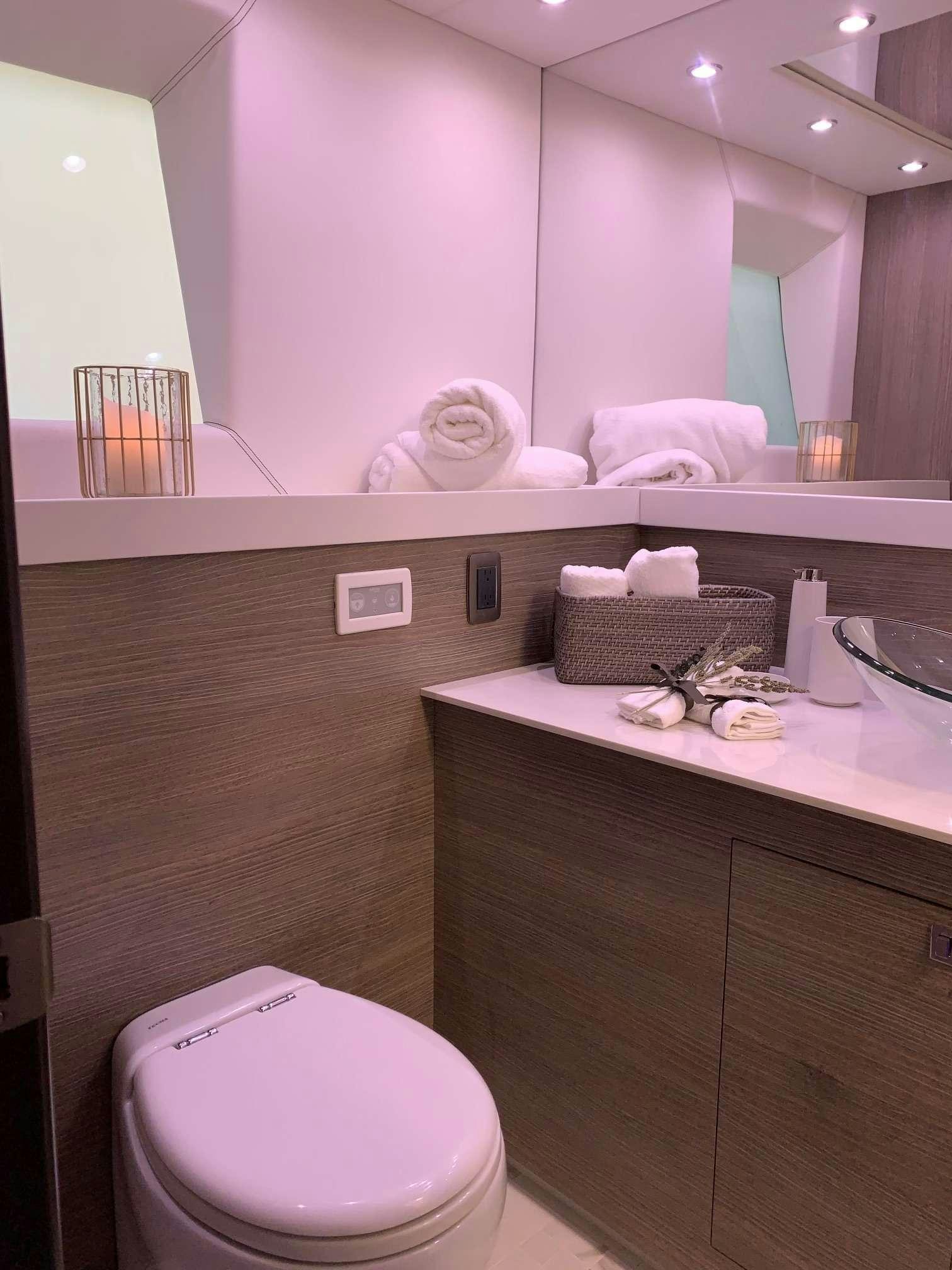 a bathroom with a pink counter aboard JULIANNE Yacht for Charter