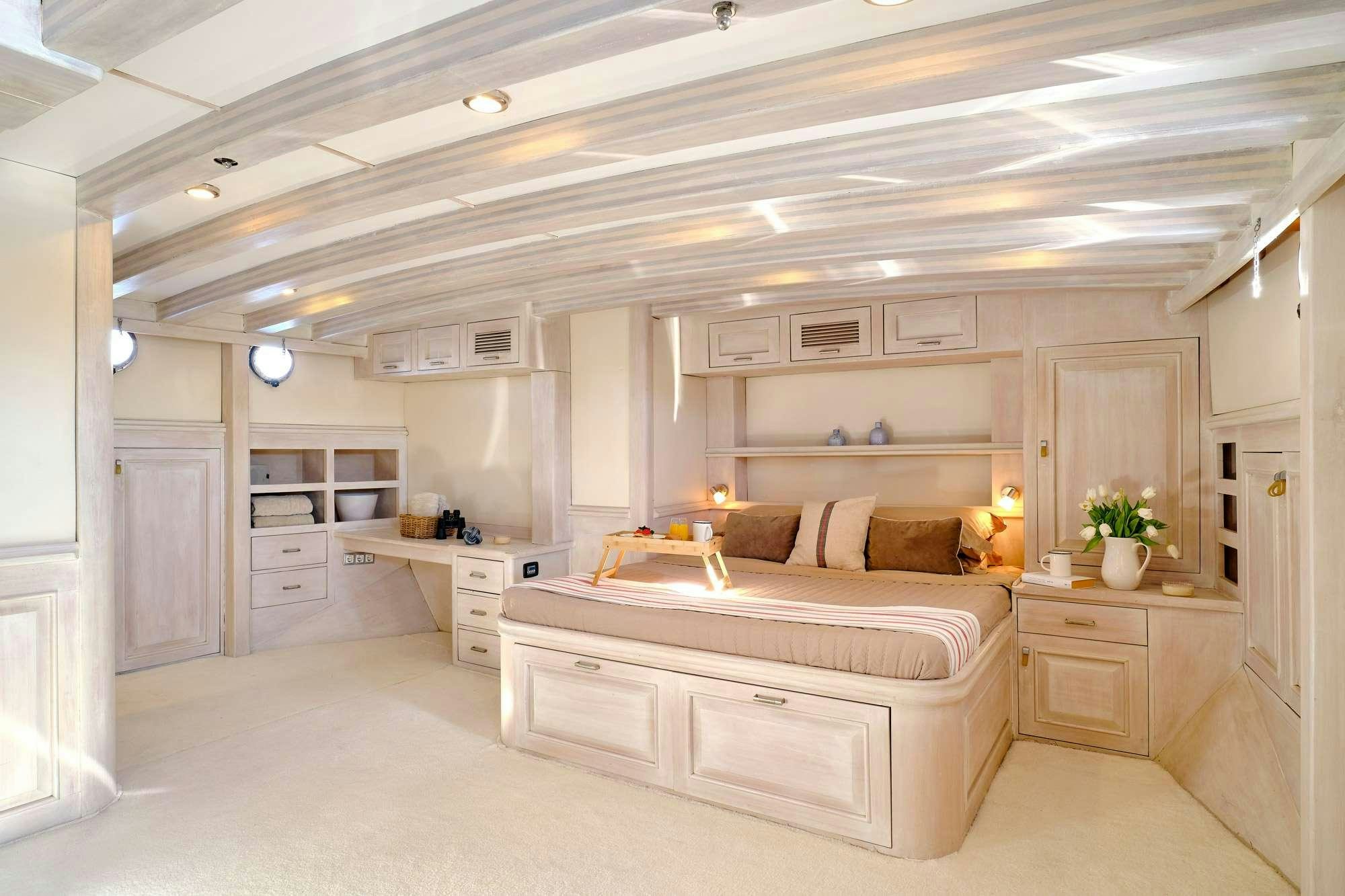 a large white and tan bedroom aboard WHITE PEARL Yacht for Charter