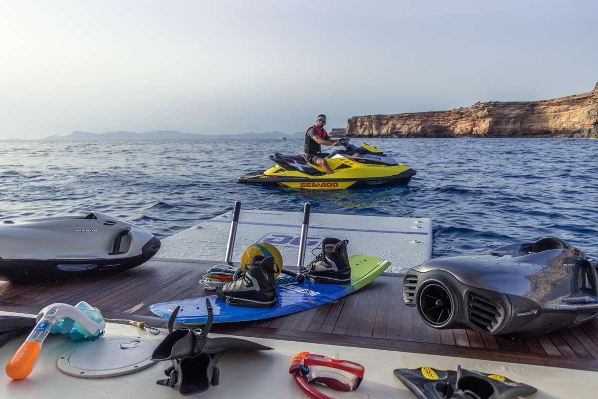 a group of people in a row boat on the water aboard CHURRI Yacht for Charter