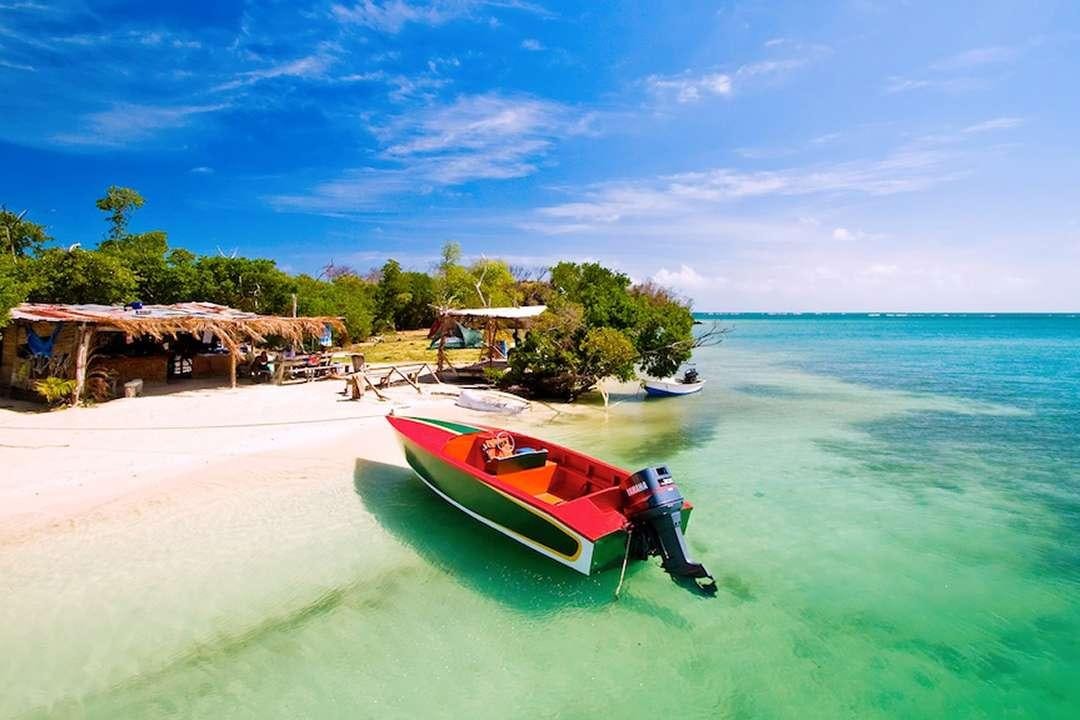 a boat on a beach aboard QUEST Yacht for Charter