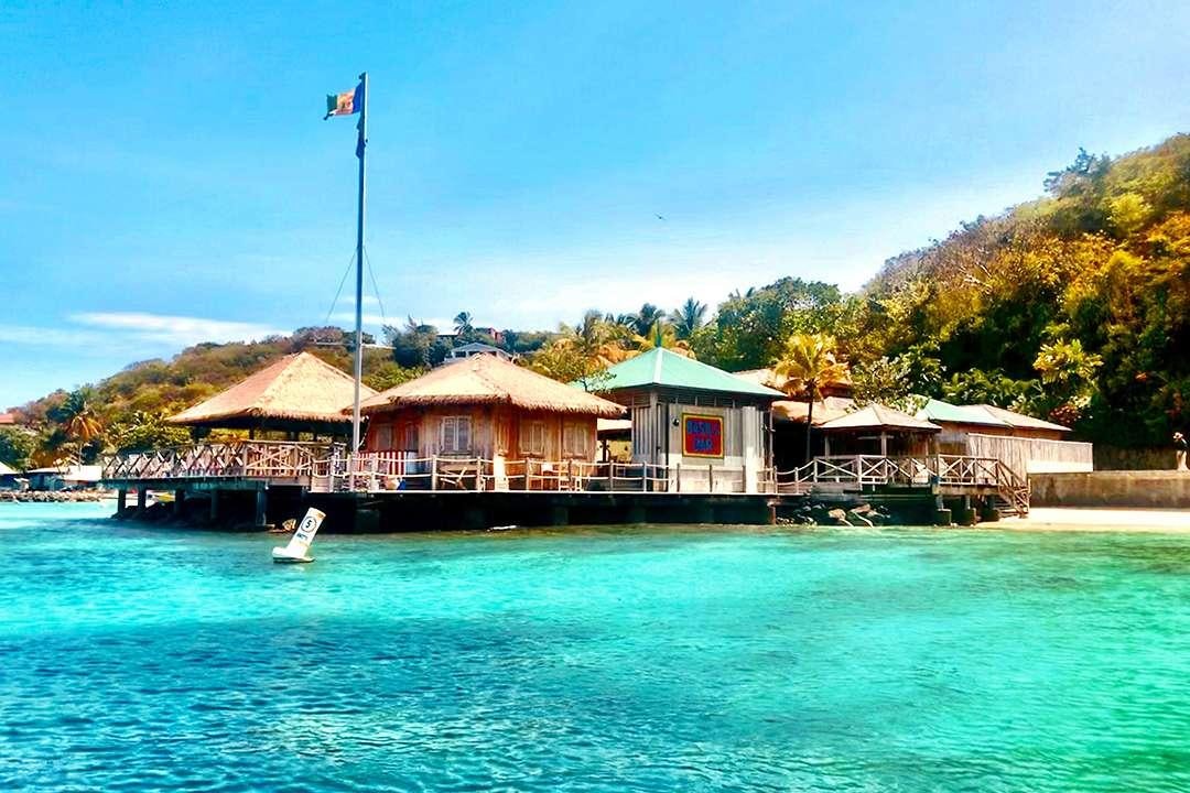 a dock with a house on it aboard QUEST Yacht for Charter