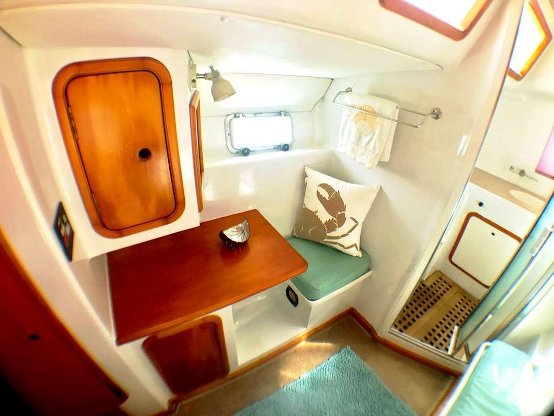 a small airplane with a desk aboard QUEST Yacht for Charter