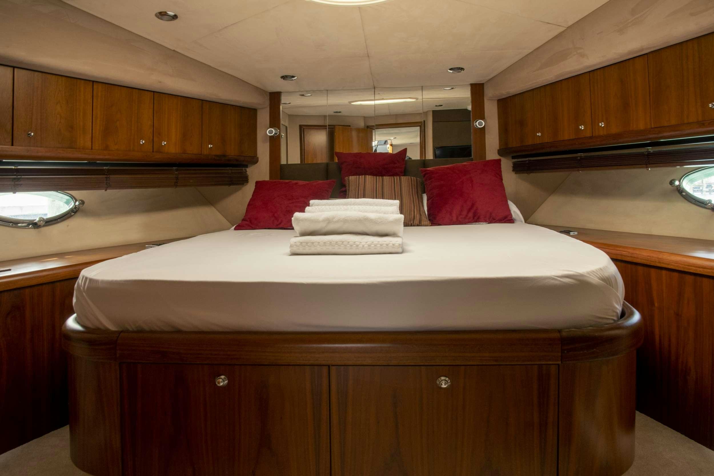a bed in a room aboard FLIGHT RISK Yacht for Charter