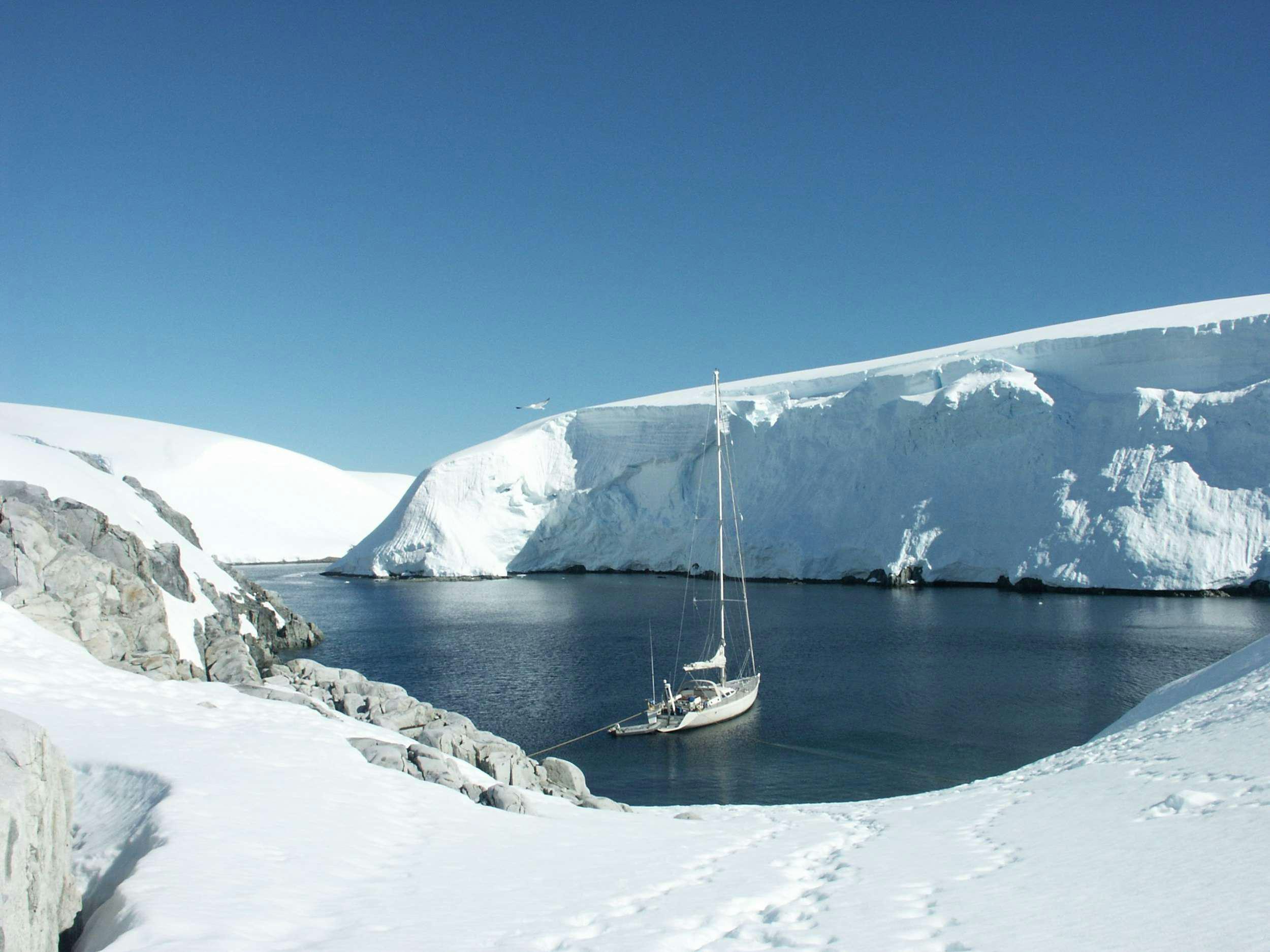 a large iceberg in the water aboard TANANA Yacht for Charter