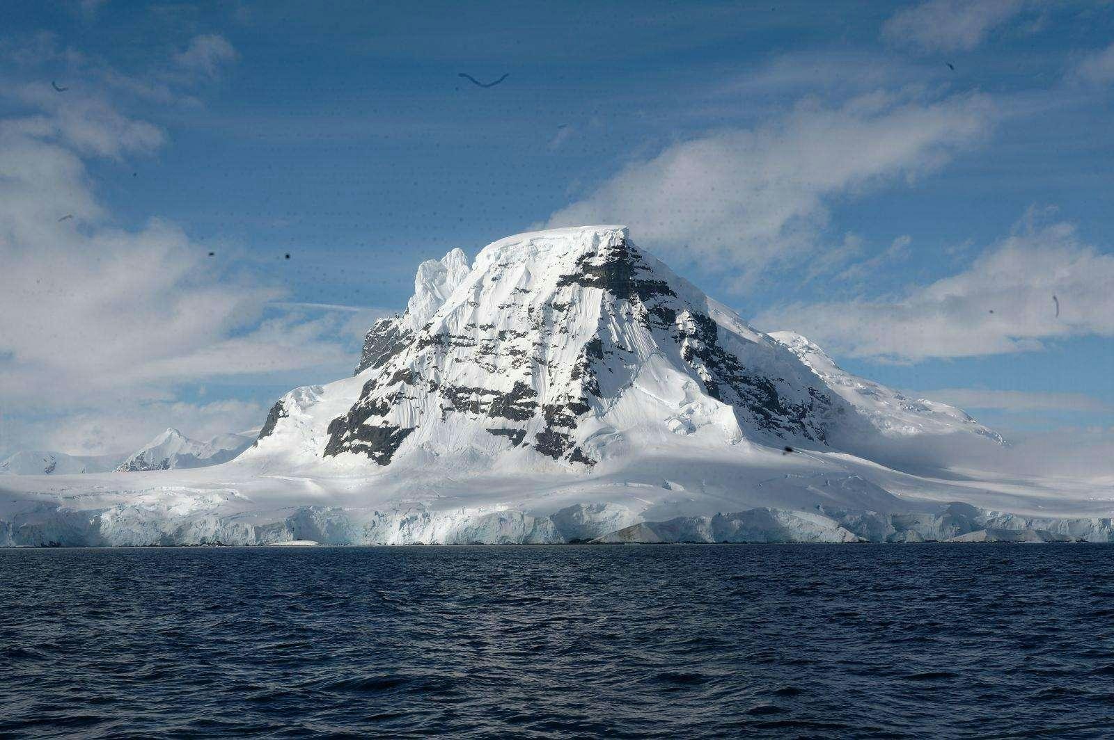 a large iceberg in the ocean aboard TANANA Yacht for Charter