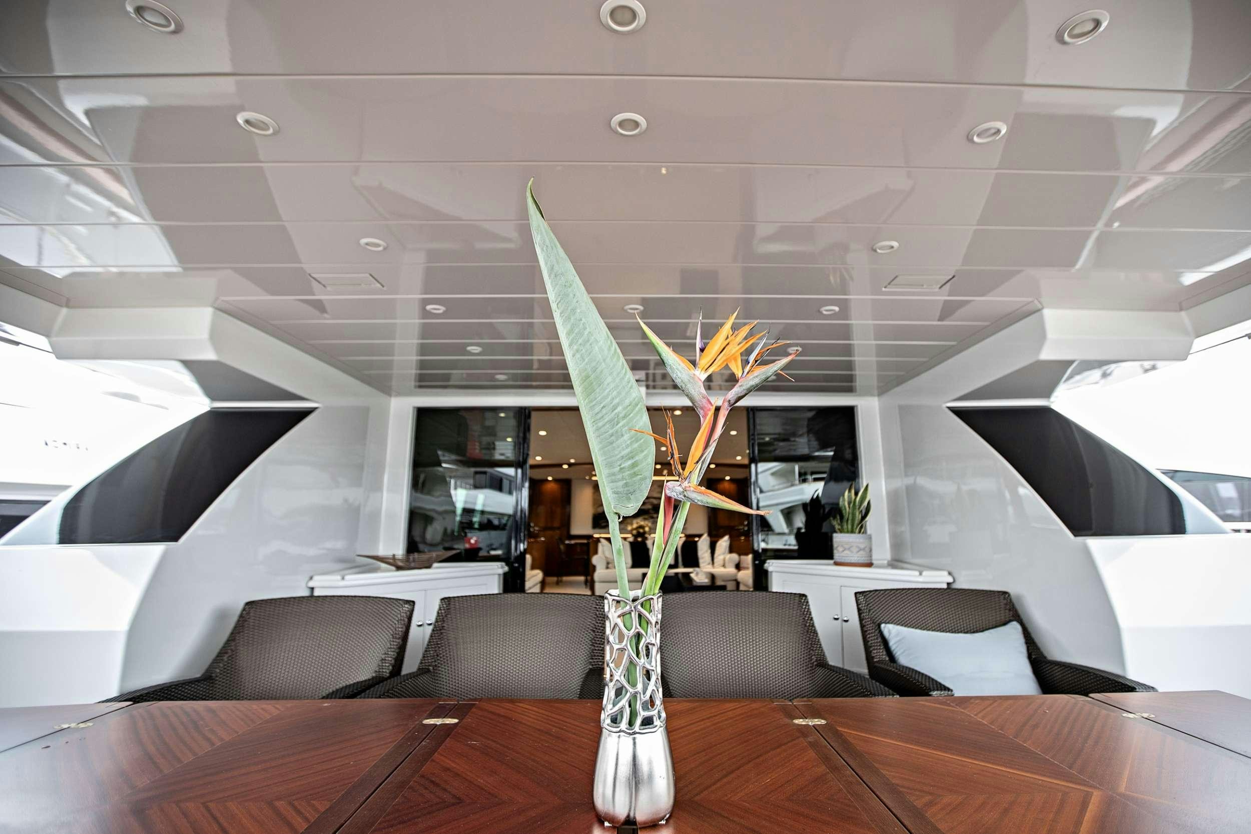 a vase with flowers in it aboard THEION Yacht for Charter