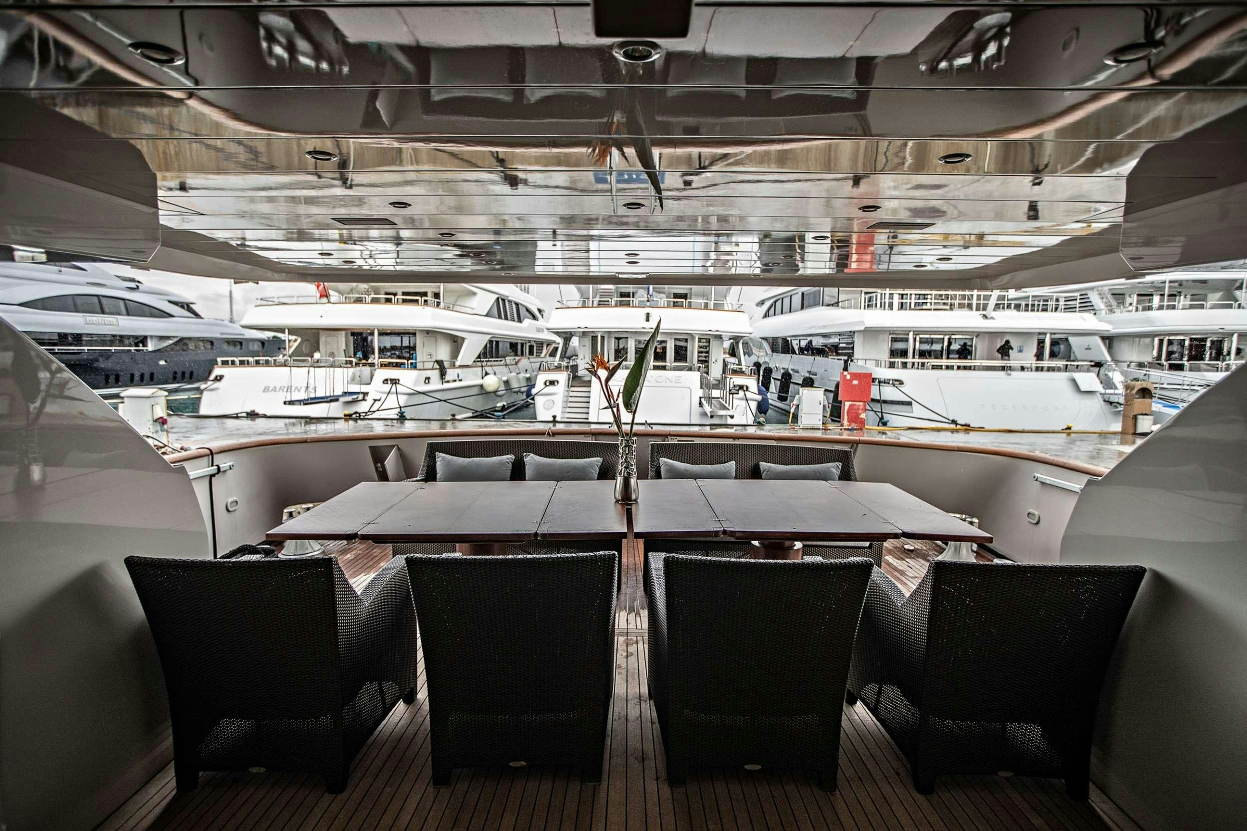 a group of chairs in a room aboard THEION Yacht for Charter