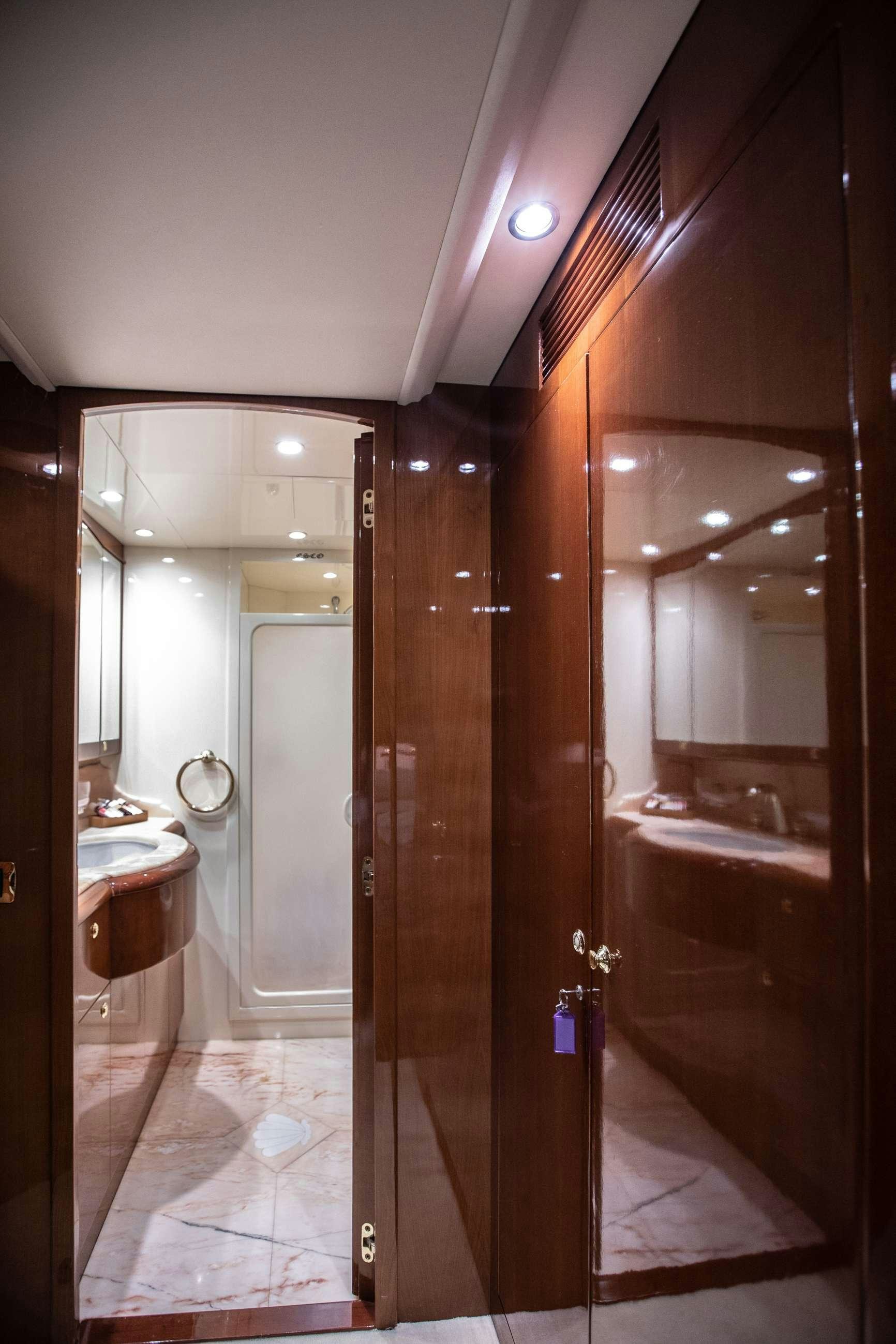 a bathroom with a large mirror aboard THEION Yacht for Charter