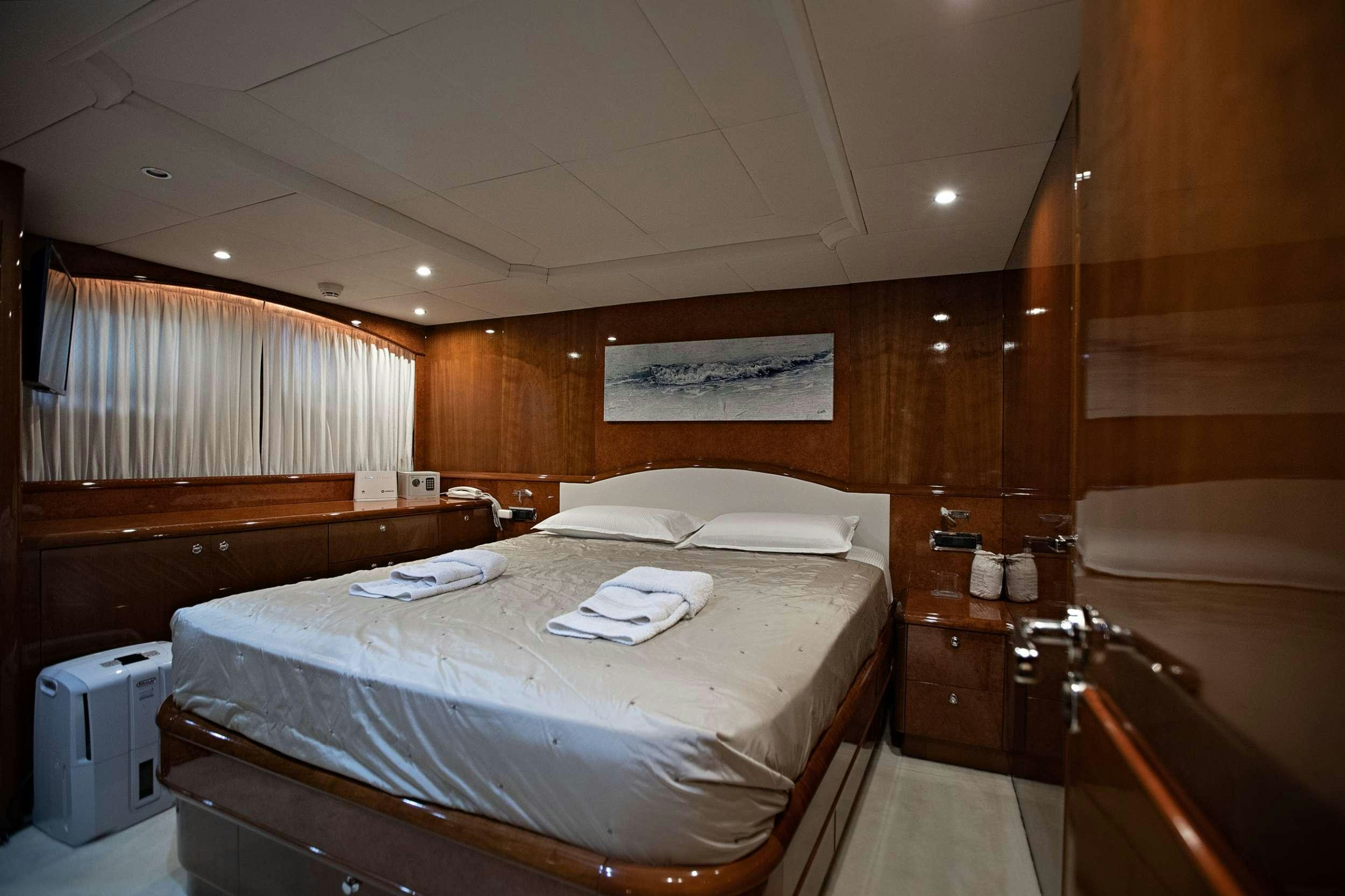 a bathroom with a bed and a sink aboard THEION Yacht for Charter