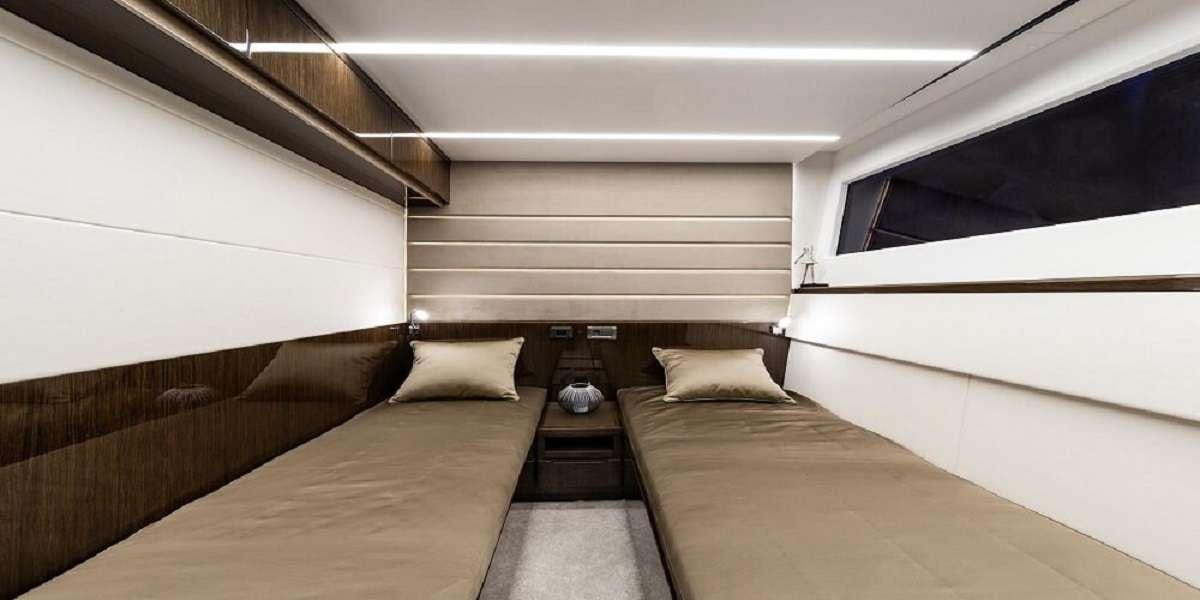 a room with two beds aboard TRIPLE T Yacht for Charter