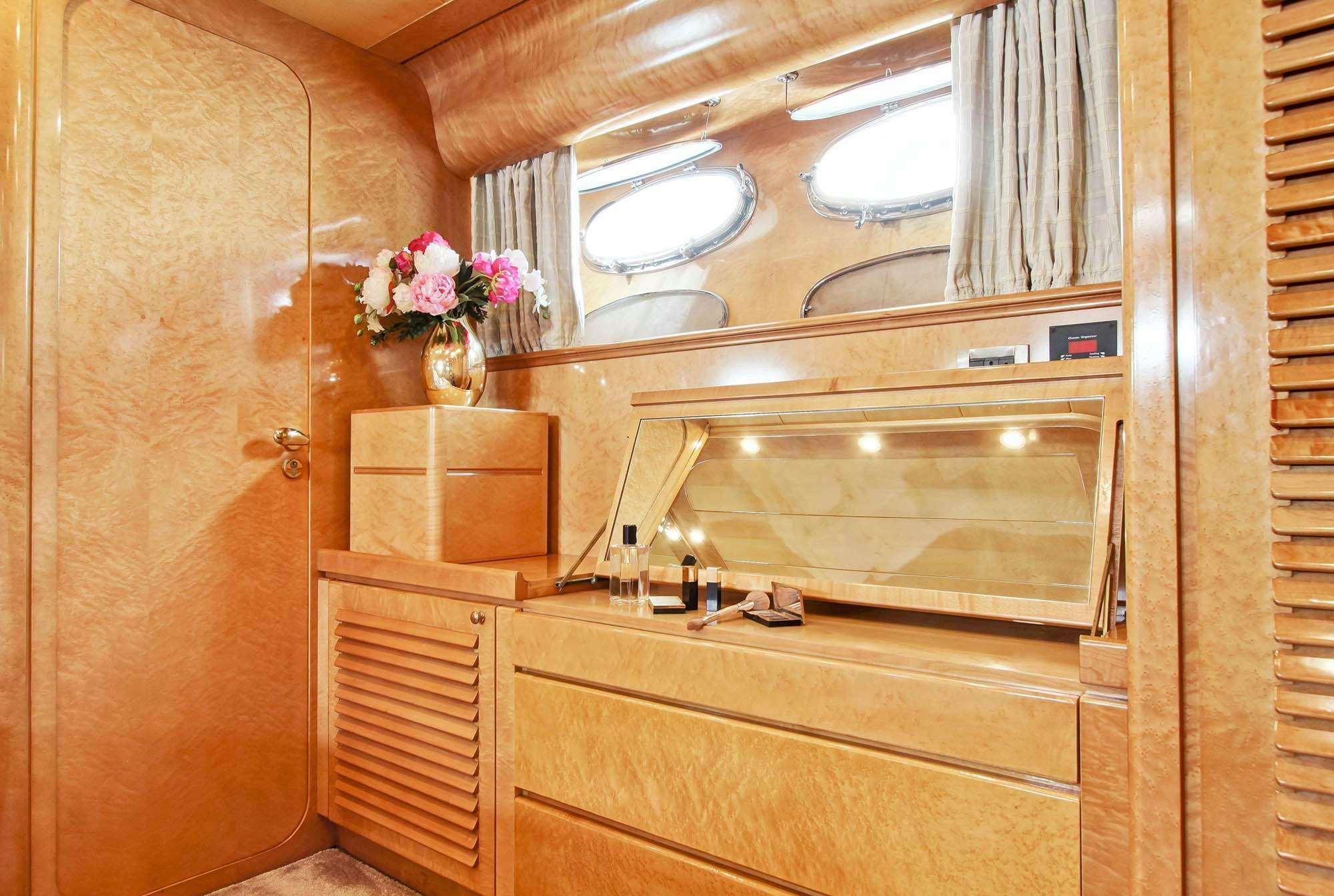 a bathroom with a sink and cabinets aboard PRIME Yacht for Charter