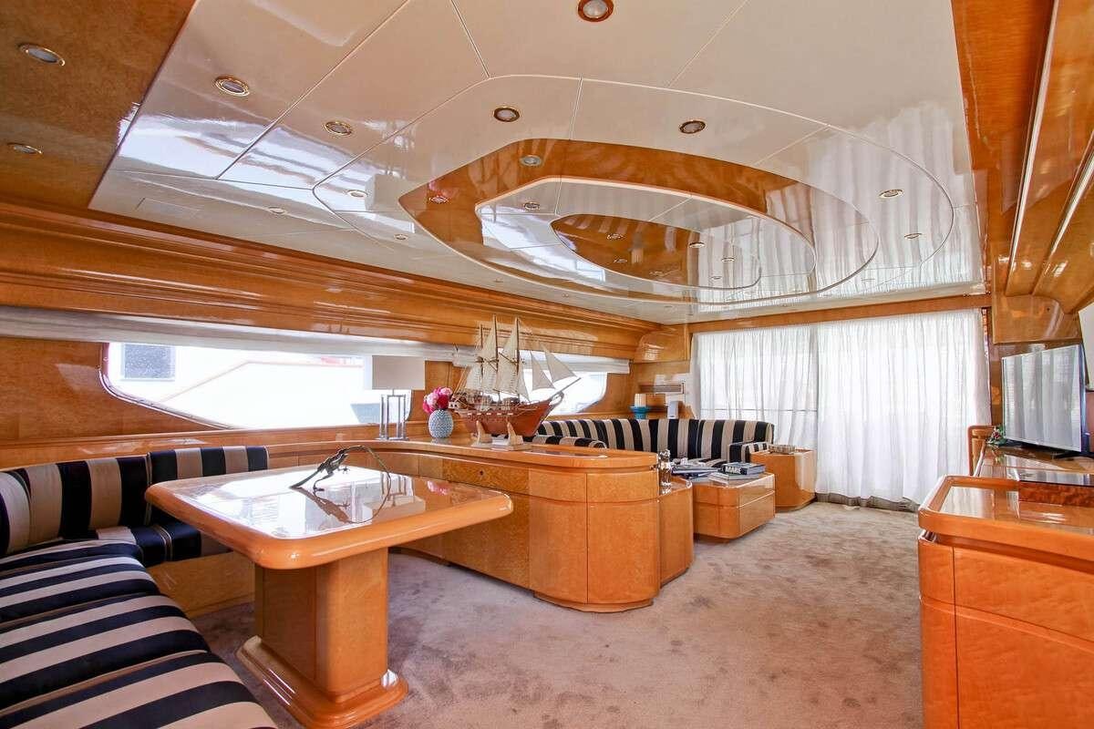 a room with a table and a bed aboard PRIME Yacht for Charter