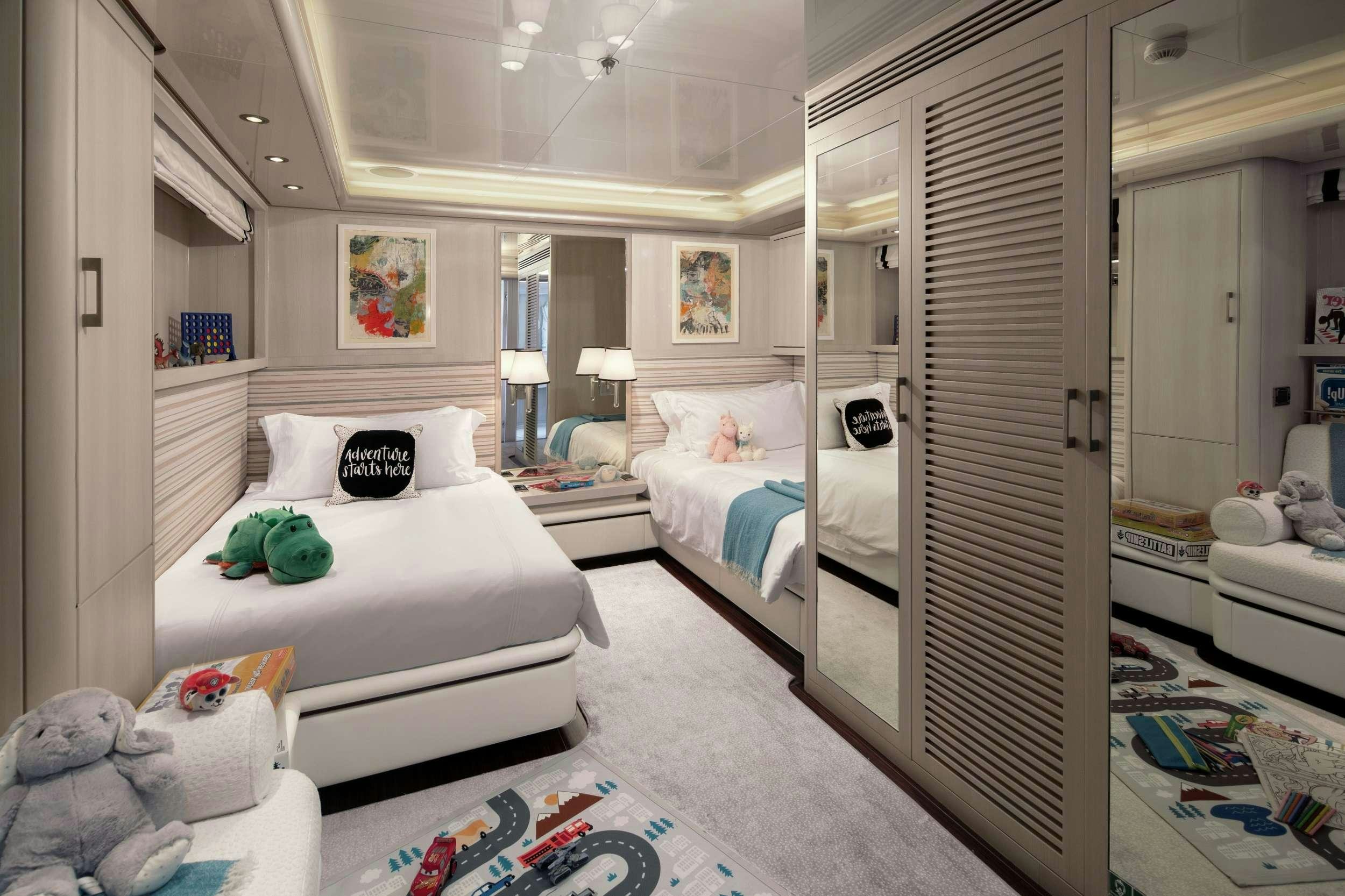 a bedroom with a bed and a closet aboard ETERNITY Yacht for Charter