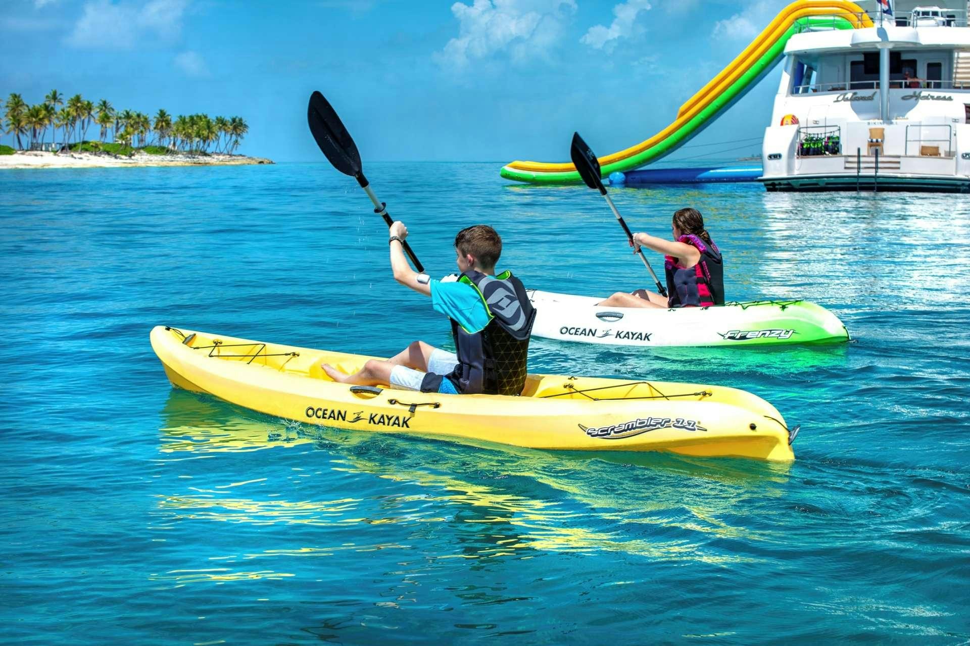 a group of people in kayaks aboard ISLAND HEIRESS Yacht for Charter