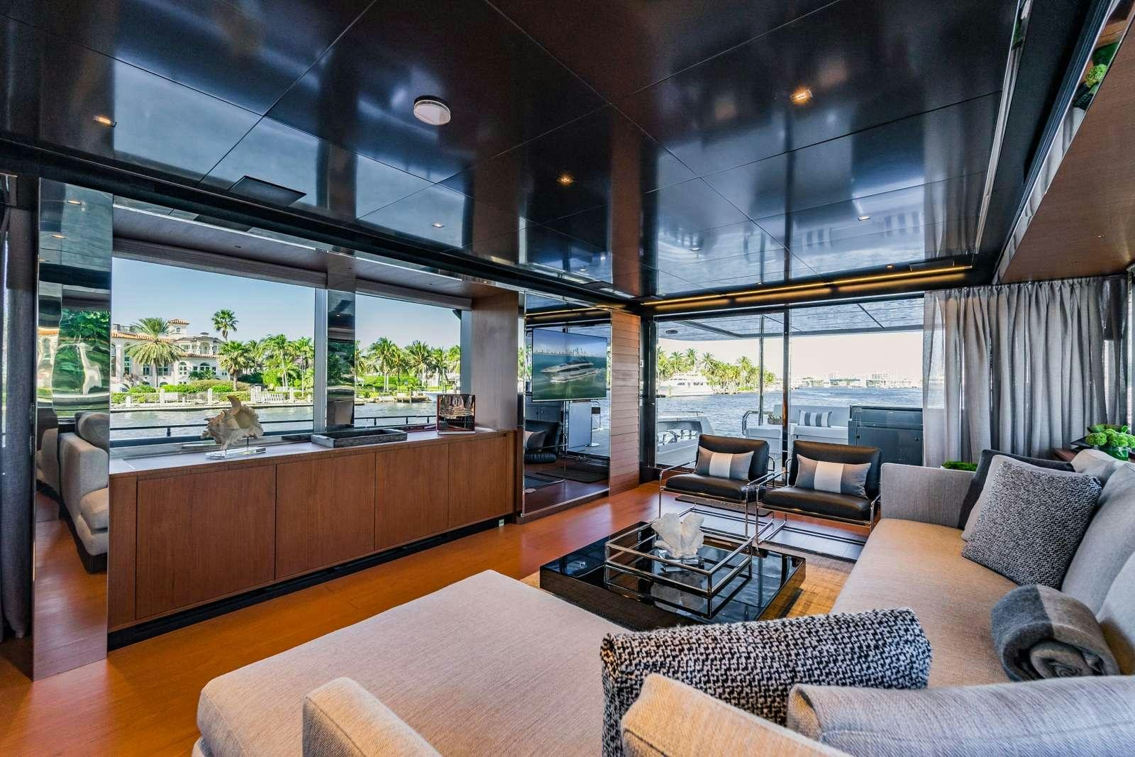 a living room with a large window aboard BEYOND BEYOND Yacht for Charter