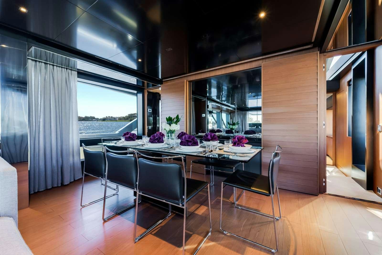 a table and chairs in a room aboard BEYOND BEYOND Yacht for Charter