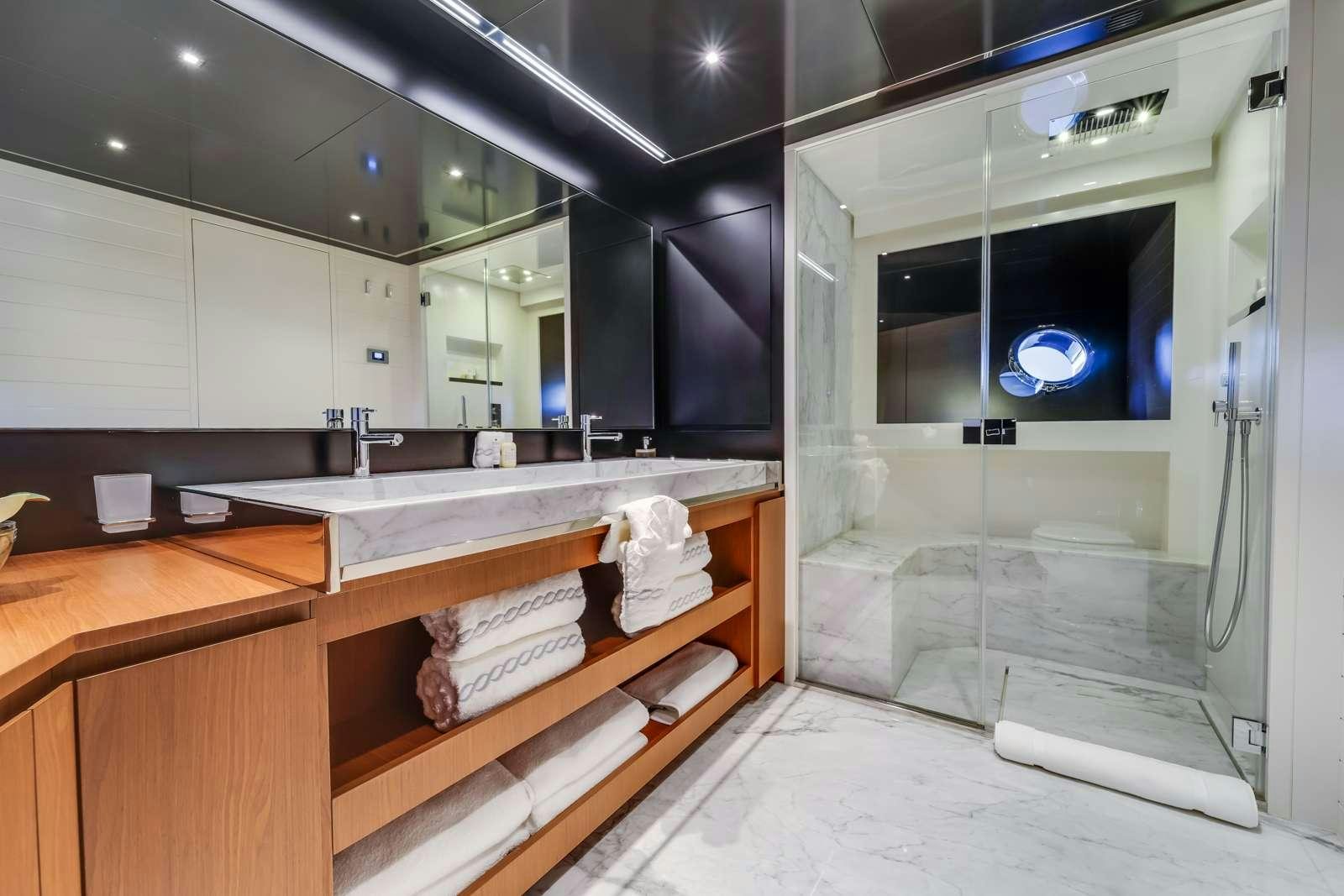a bathroom with a large mirror aboard BEYOND BEYOND Yacht for Charter
