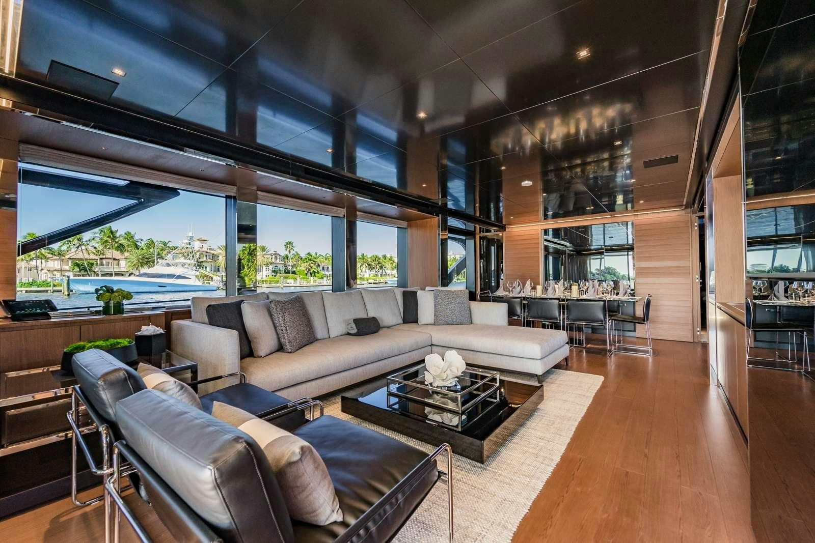 a living room with a large window aboard BEYOND BEYOND Yacht for Charter