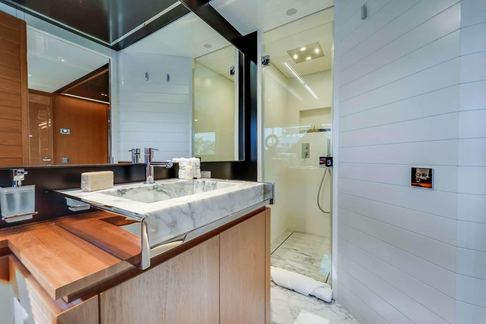 a bathroom with a sink and a mirror aboard BEYOND BEYOND Yacht for Charter
