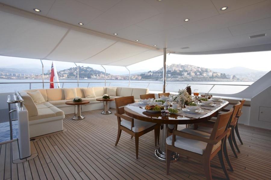 a room with a table and chairs aboard KATHLEEN ANNE Yacht for Charter