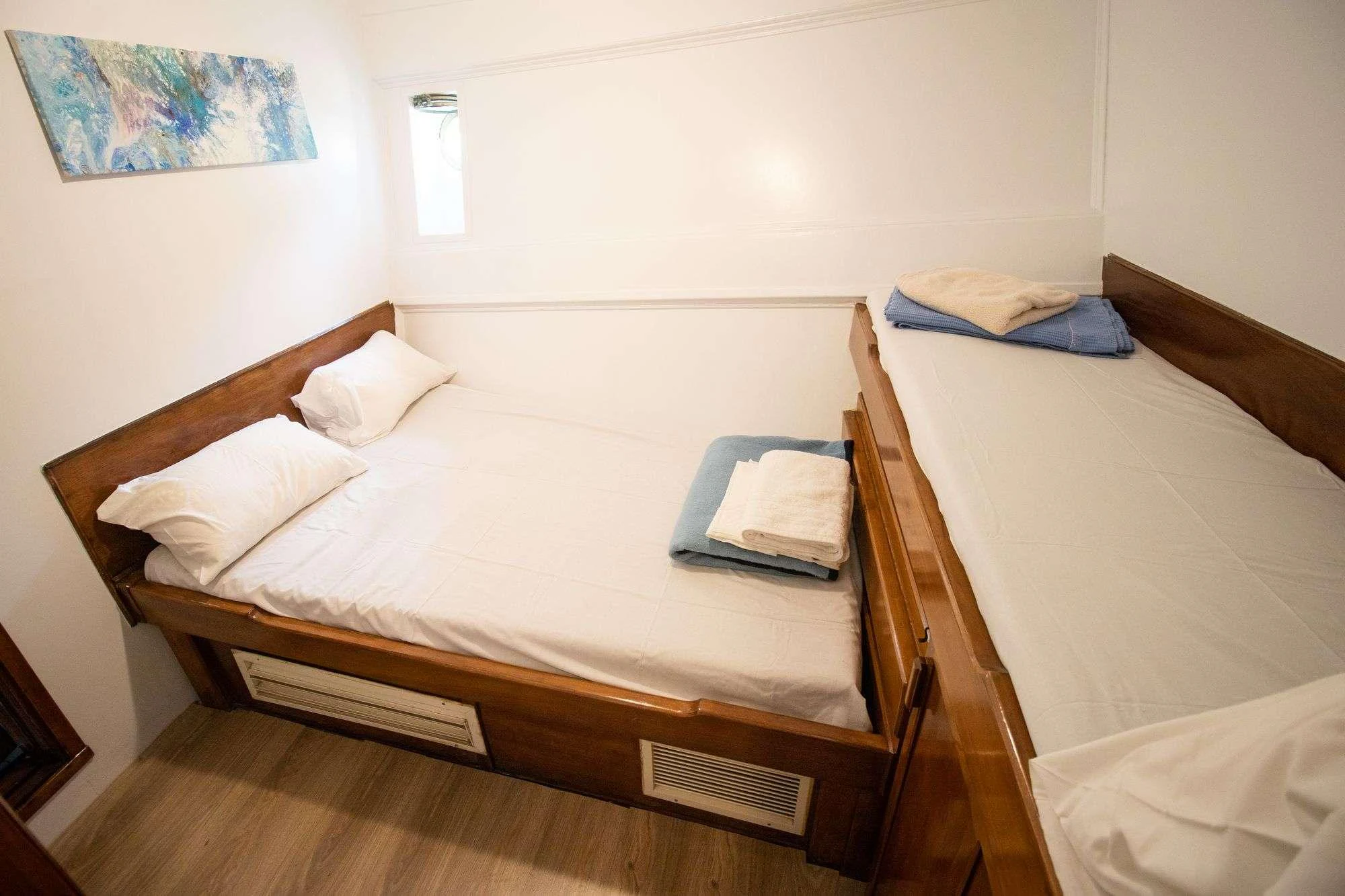 a couple of beds in a room aboard AEGEOTISSA II Yacht for Charter
