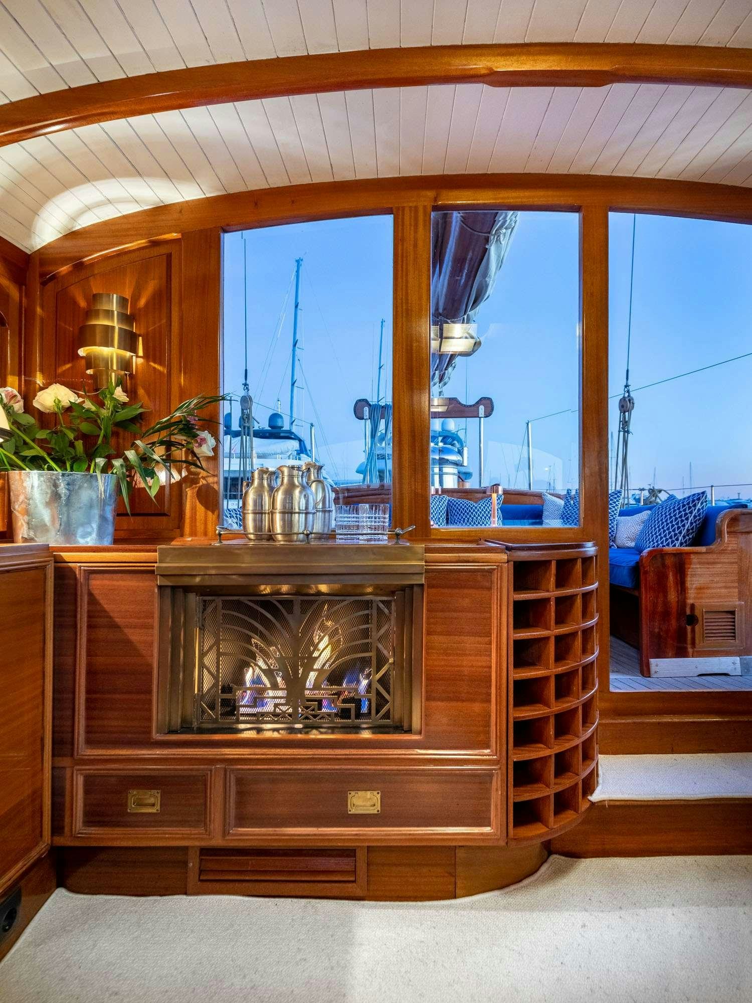 a room with a fireplace aboard WEATHER BIRD Yacht for Charter