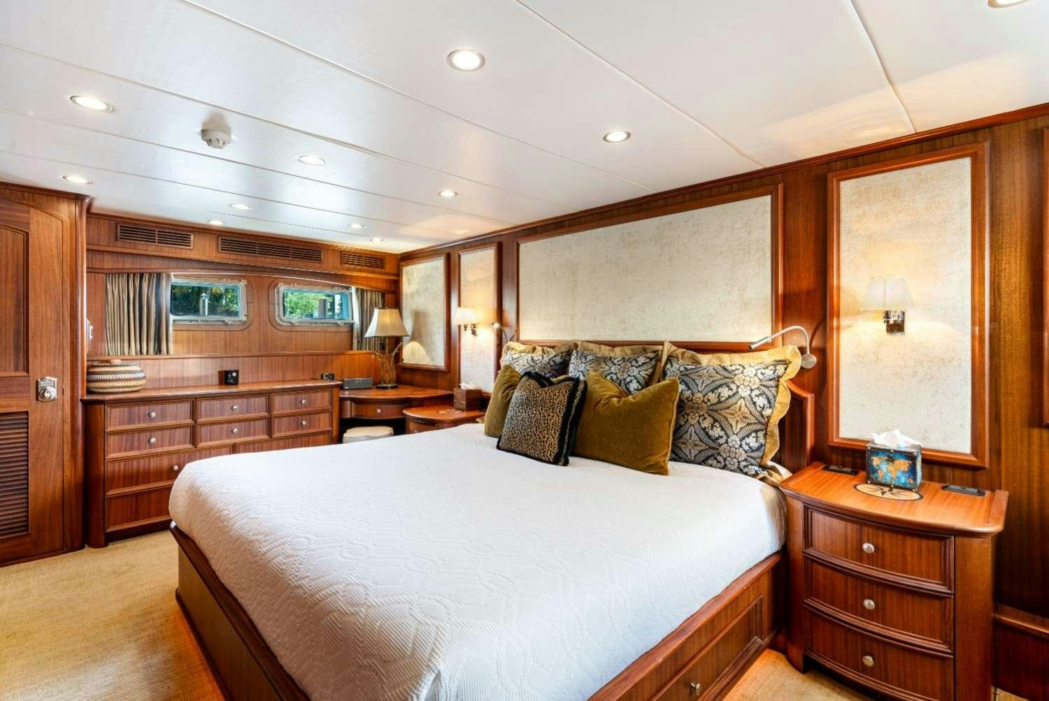 a large bed in a room aboard SEAS TO SEE Yacht for Charter