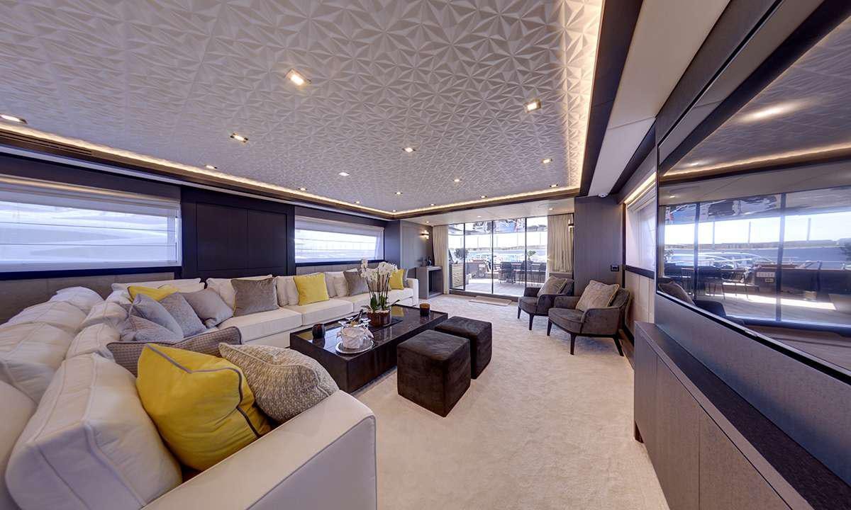 a living room with a large window aboard NOEMA Yacht for Charter