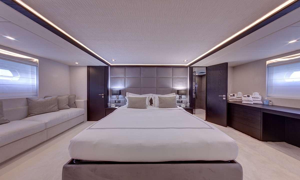 a large bed in a room aboard NOEMA Yacht for Charter
