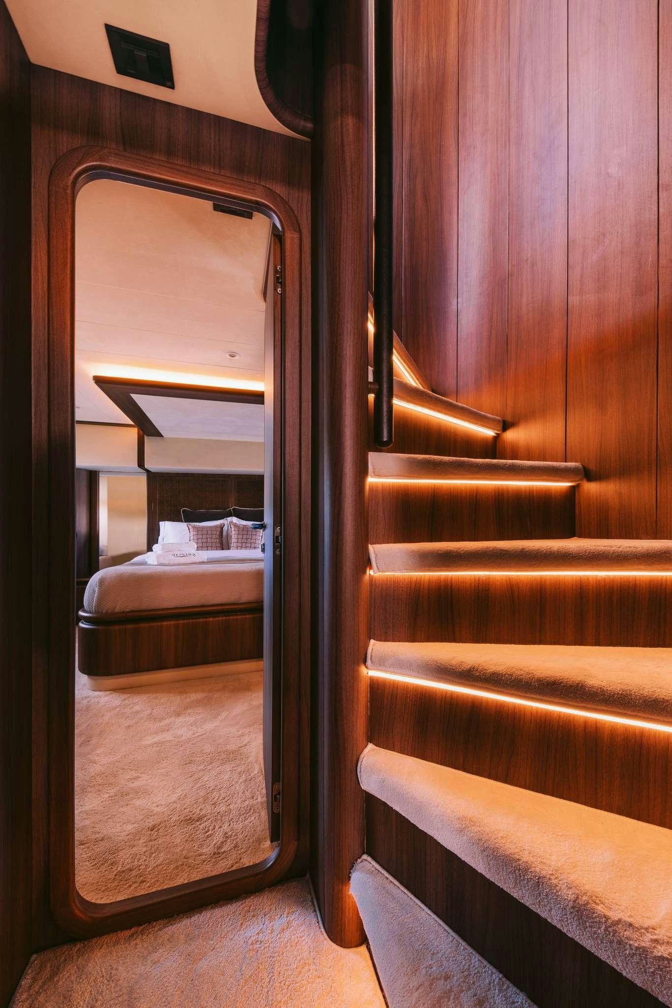 a train with a bed and a window aboard OXYGEN 8 Yacht for Charter