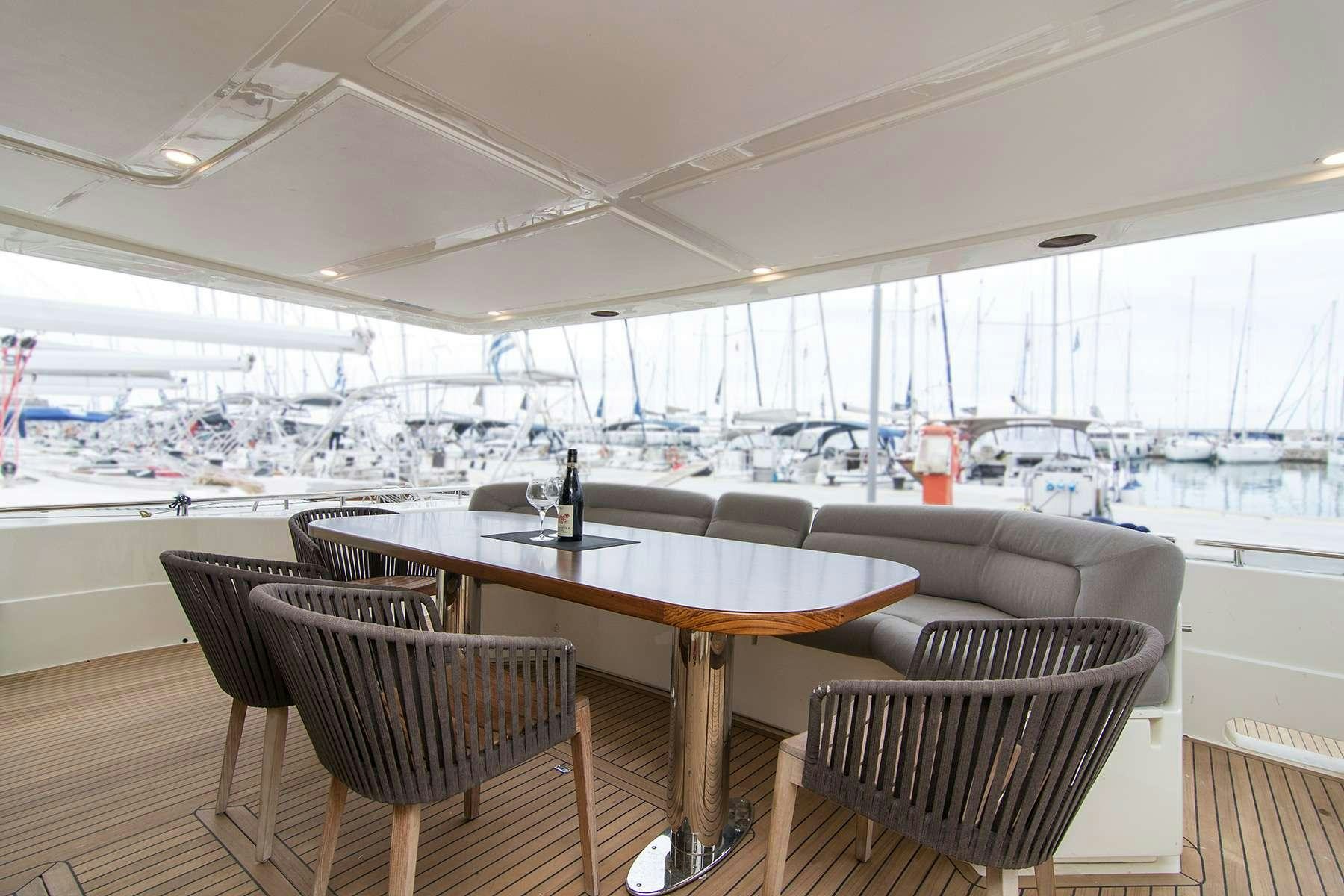 a table and chairs in a room aboard OXYGEN 8 Yacht for Charter