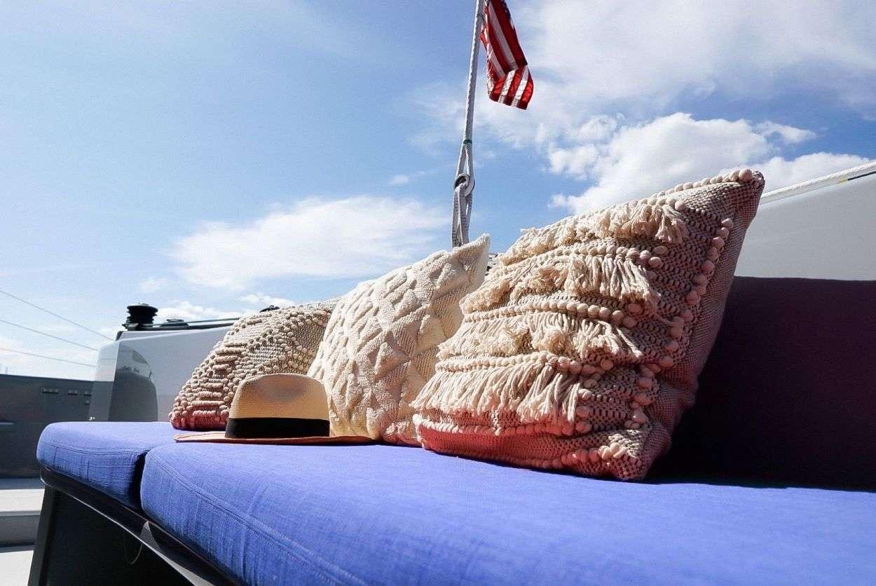 a boat with a flag on it aboard GAIA Yacht for Charter