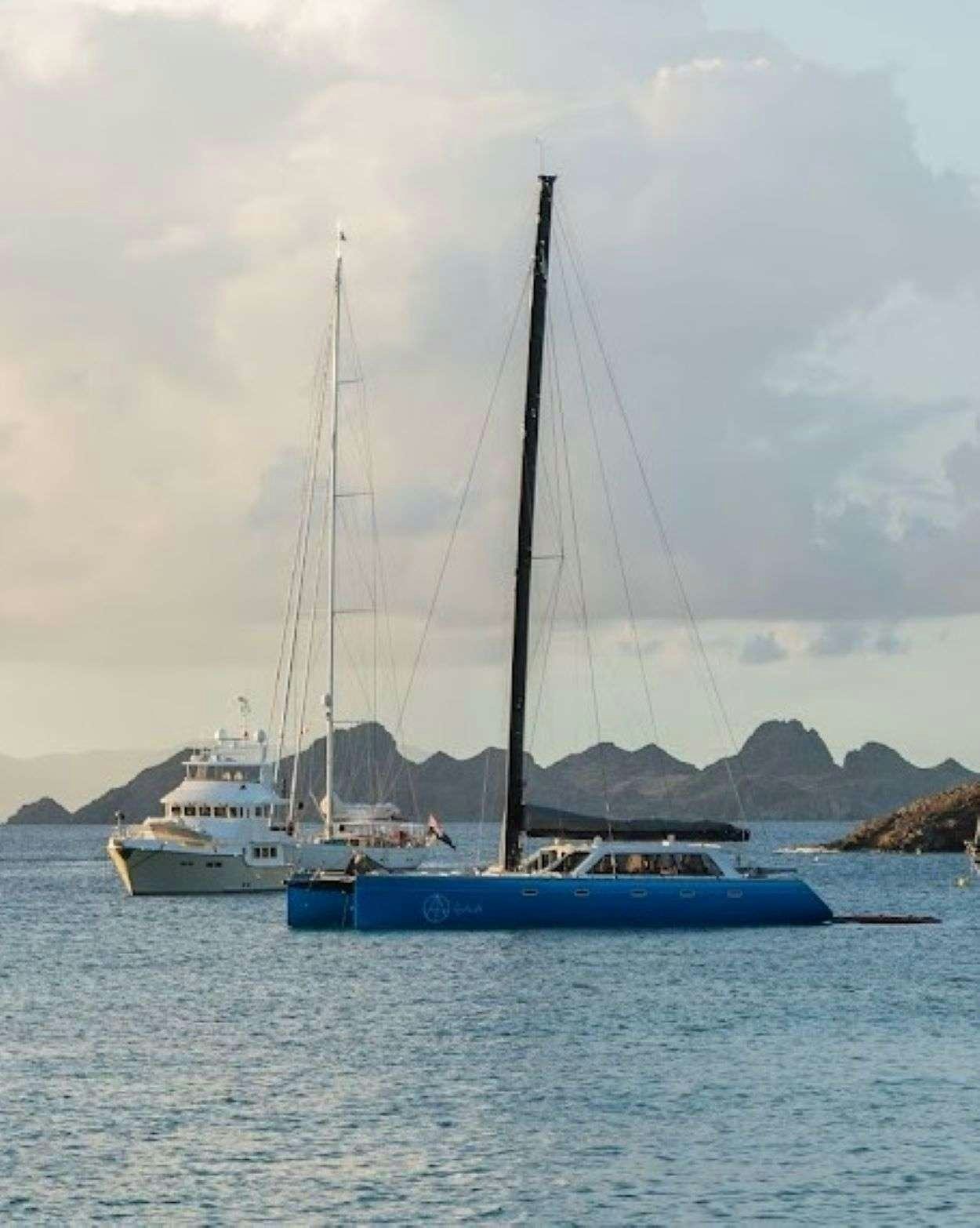a group of boats on the water aboard GAIA Yacht for Charter