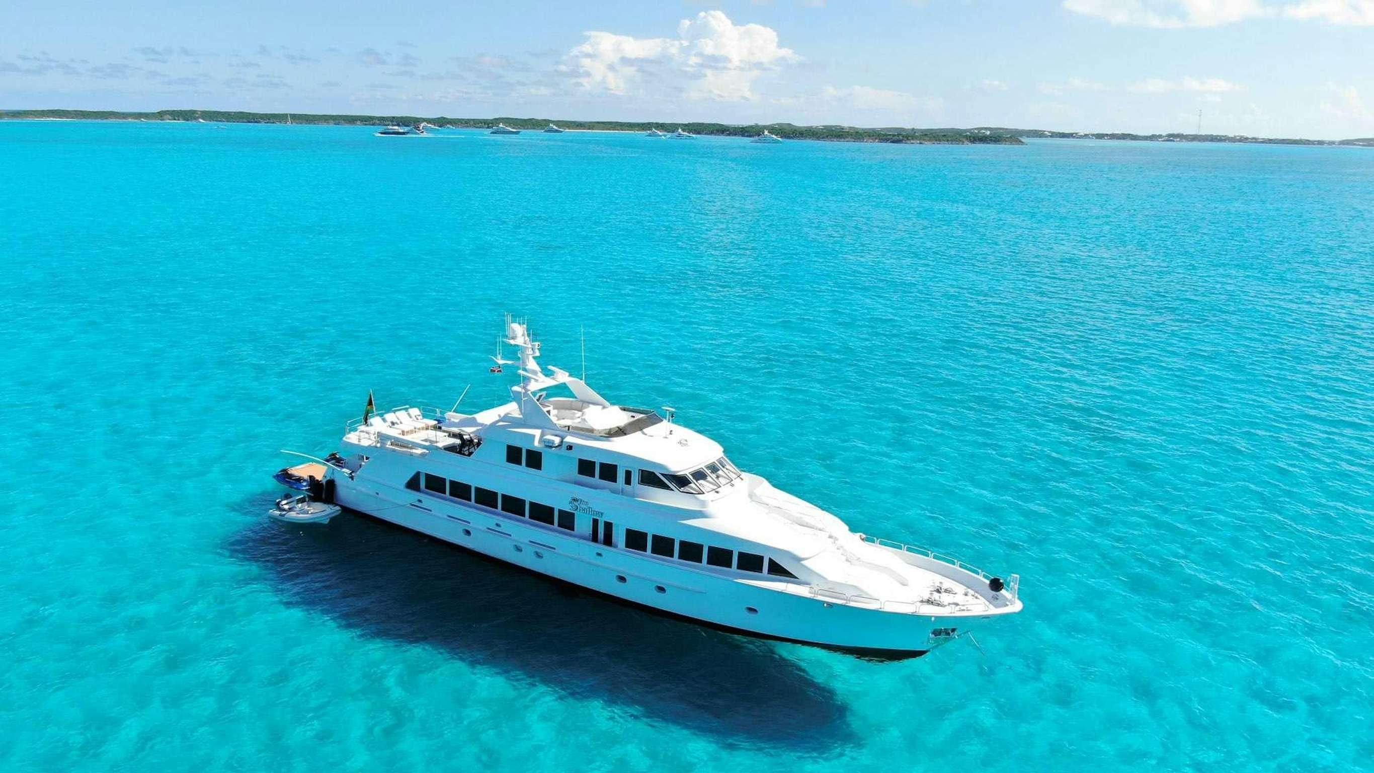 a white boat in the water aboard TOO SHALLOW Yacht for Charter