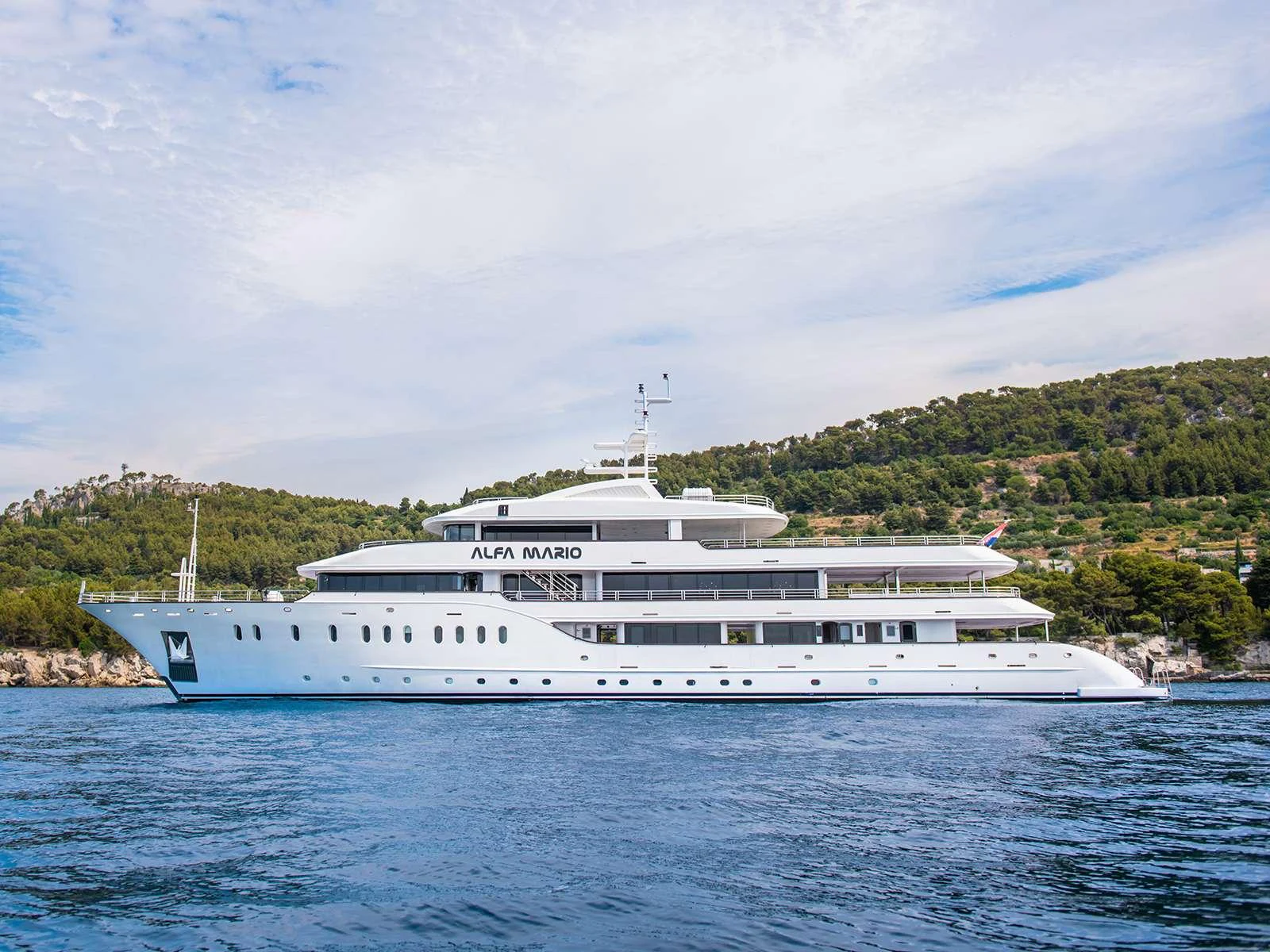 a white yacht on the water aboard ALFA MARIO Yacht for Charter