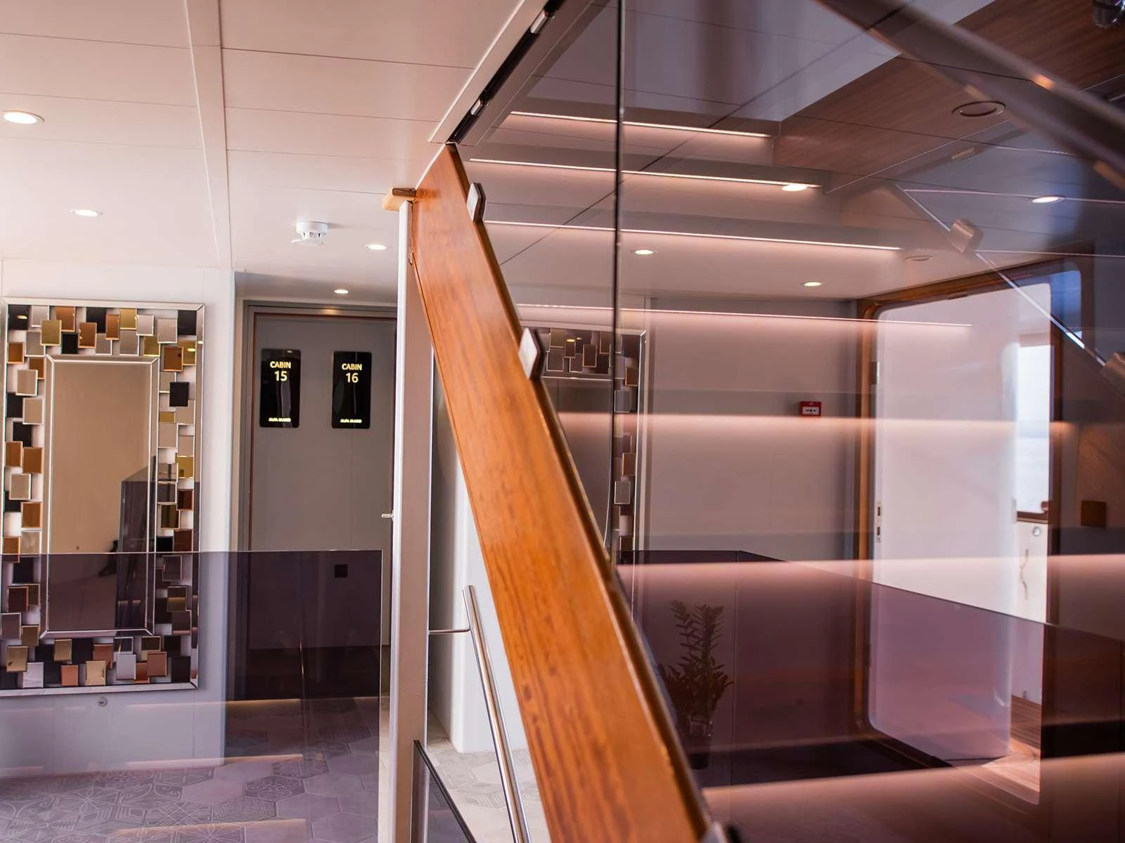 a room with a wood ladder aboard ALFA MARIO Yacht for Charter
