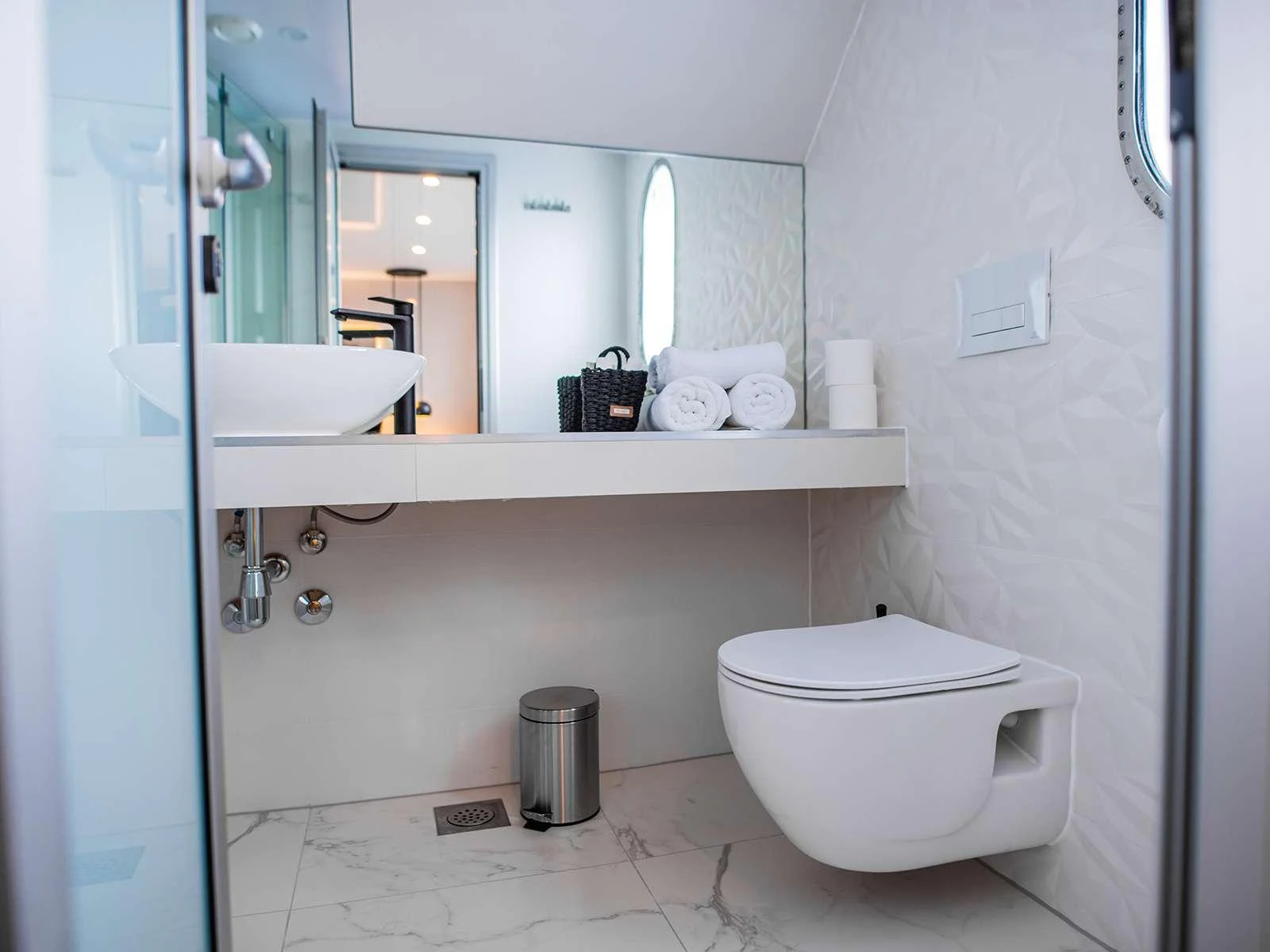 a bathroom with a toilet and a sink aboard ALFA MARIO Yacht for Charter