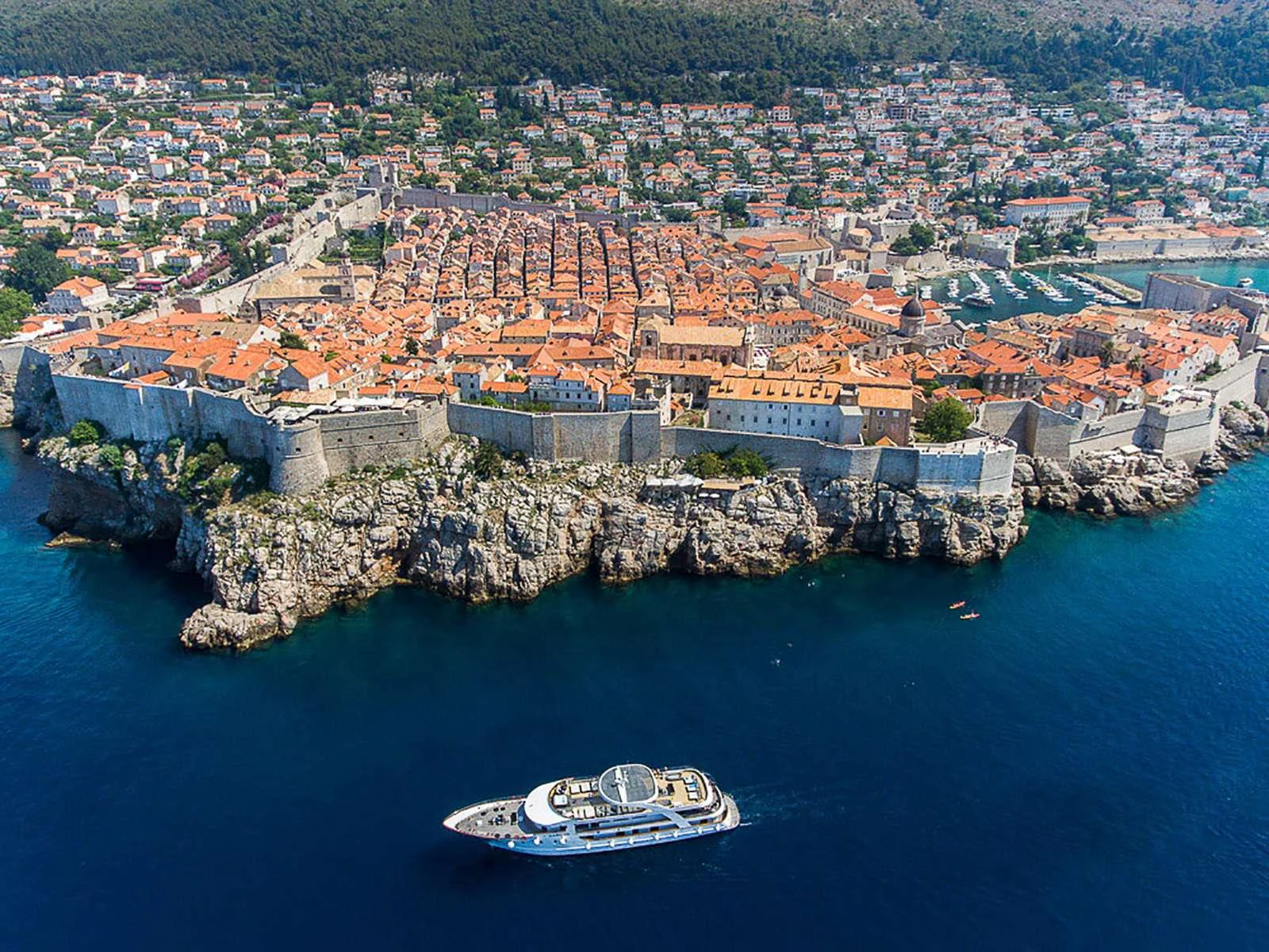 a city built on a rocky island aboard KARIZMA Yacht for Charter