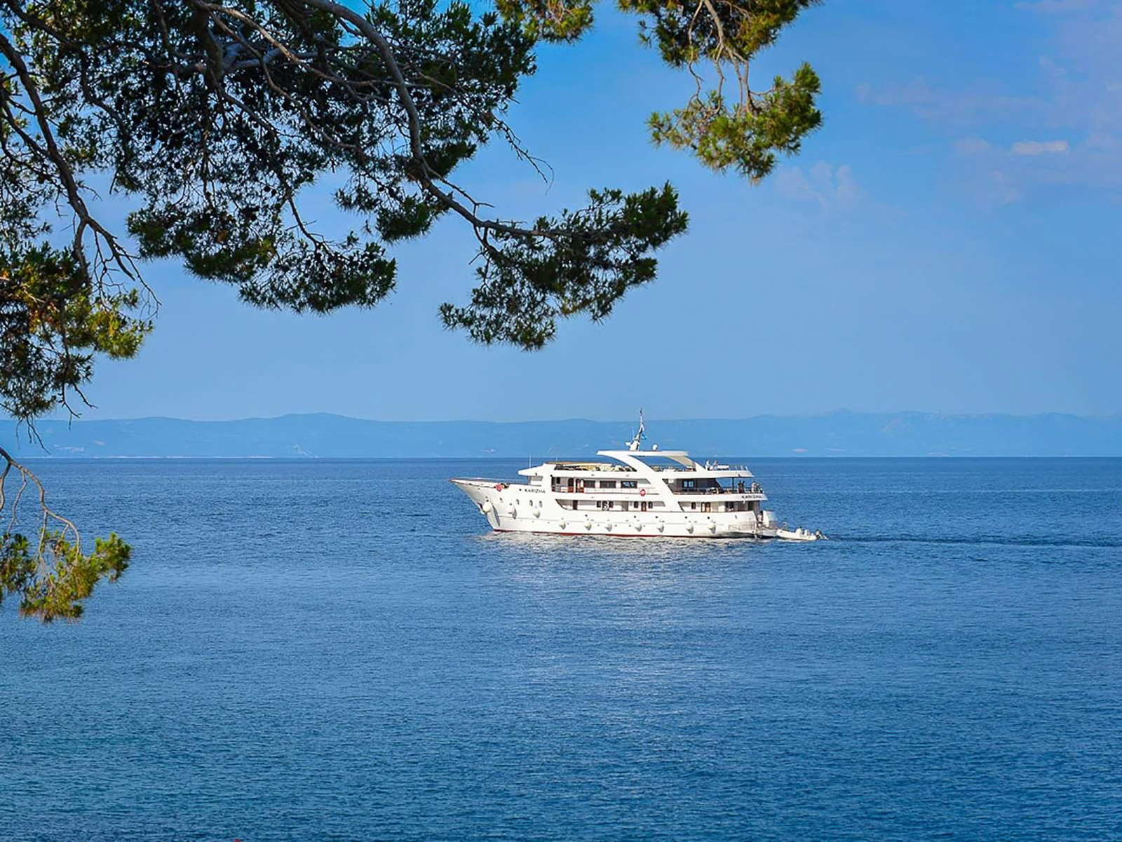 a large ship in the water aboard KARIZMA Yacht for Charter