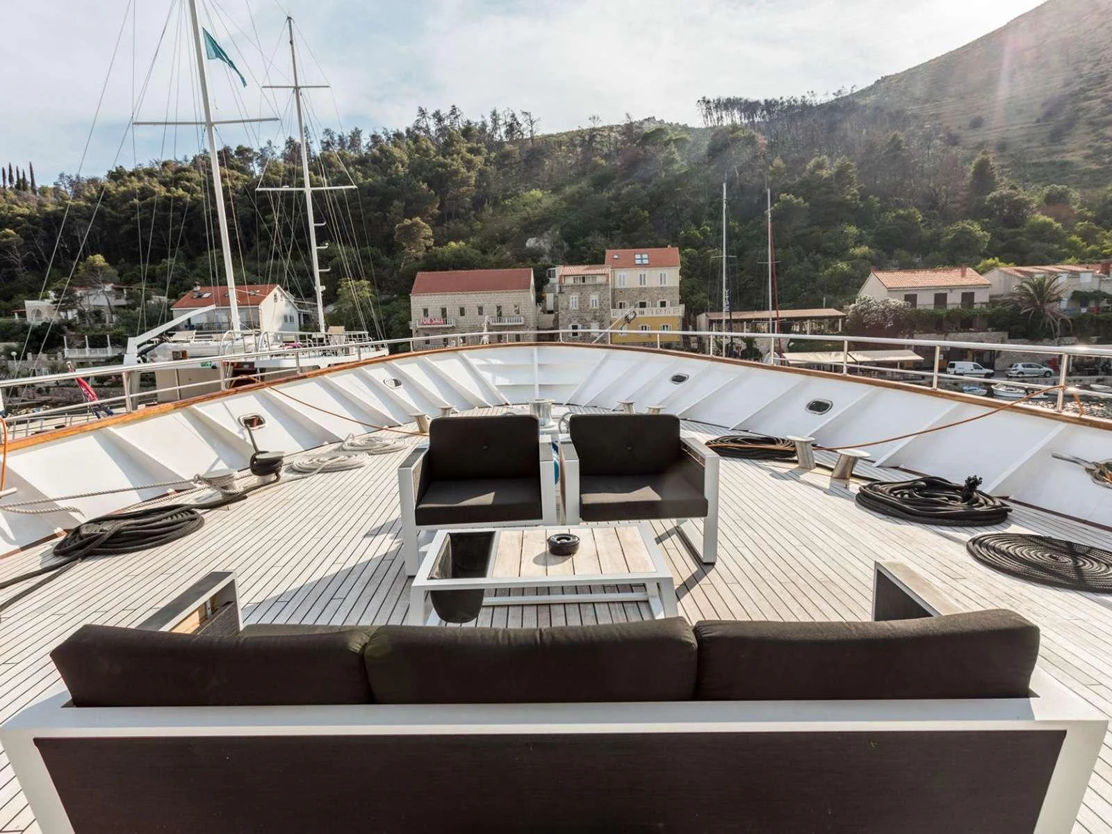 a boat dock with many boats aboard KARIZMA Yacht for Charter