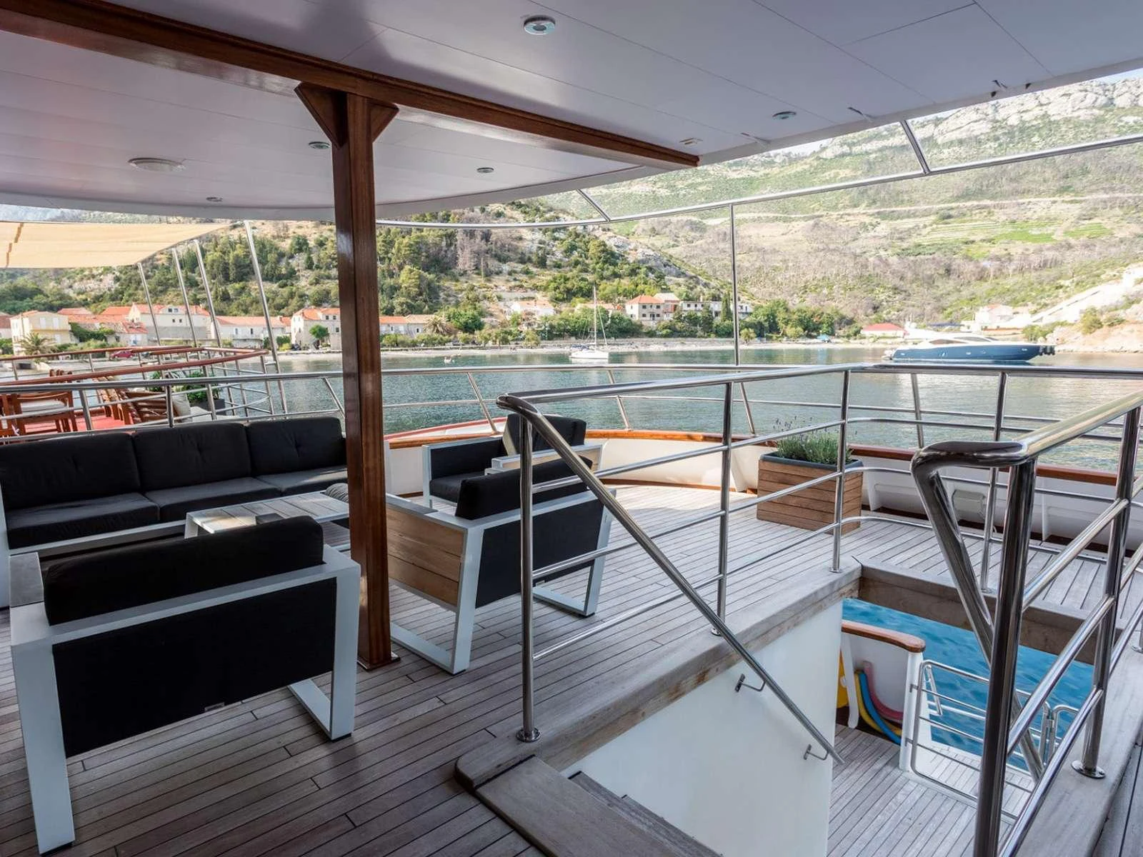 a room with a couch and a pool aboard KARIZMA Yacht for Charter